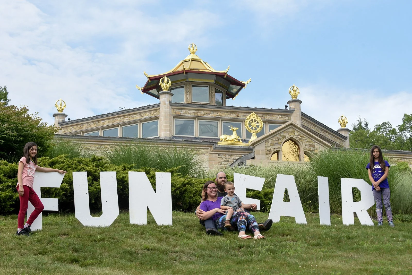 fun fair with Temple in the background