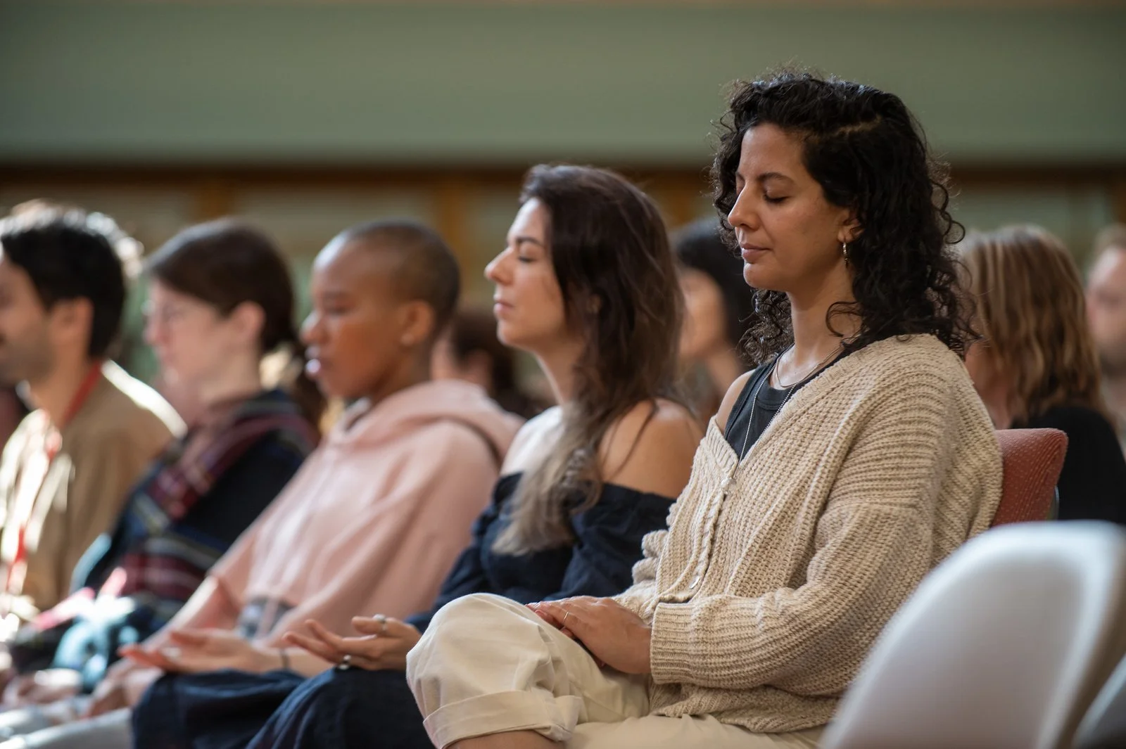 woman meditating in a group
