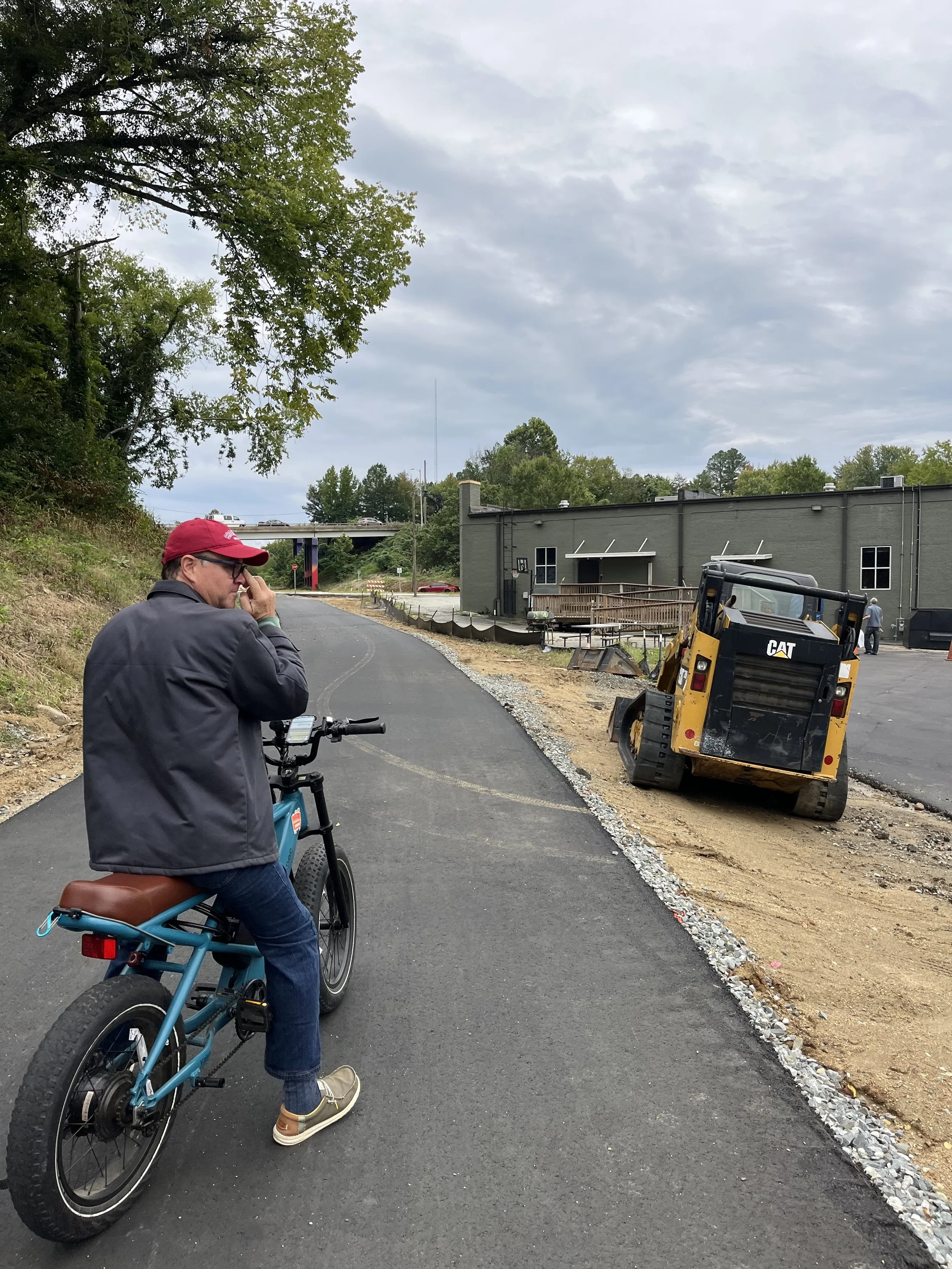 The last section of the Greenway behind Wafco Mills, between McGee Street and Spring Garden Street,  has now been paved with asphalt!! 