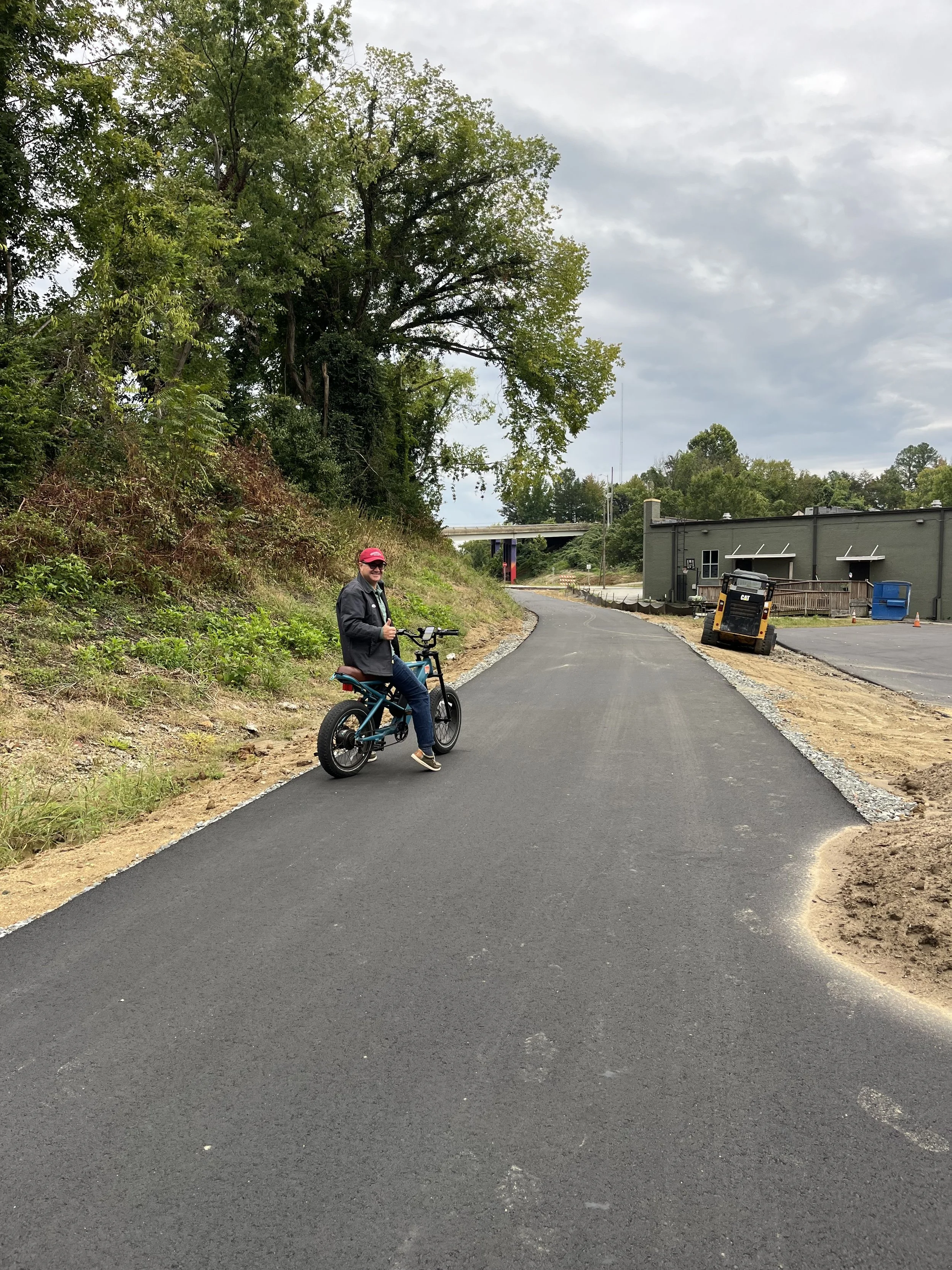  The last section of the Greenway behind Wafco Mills, between McGee Street and Spring Garden Street,  has now been paved with asphalt!! 