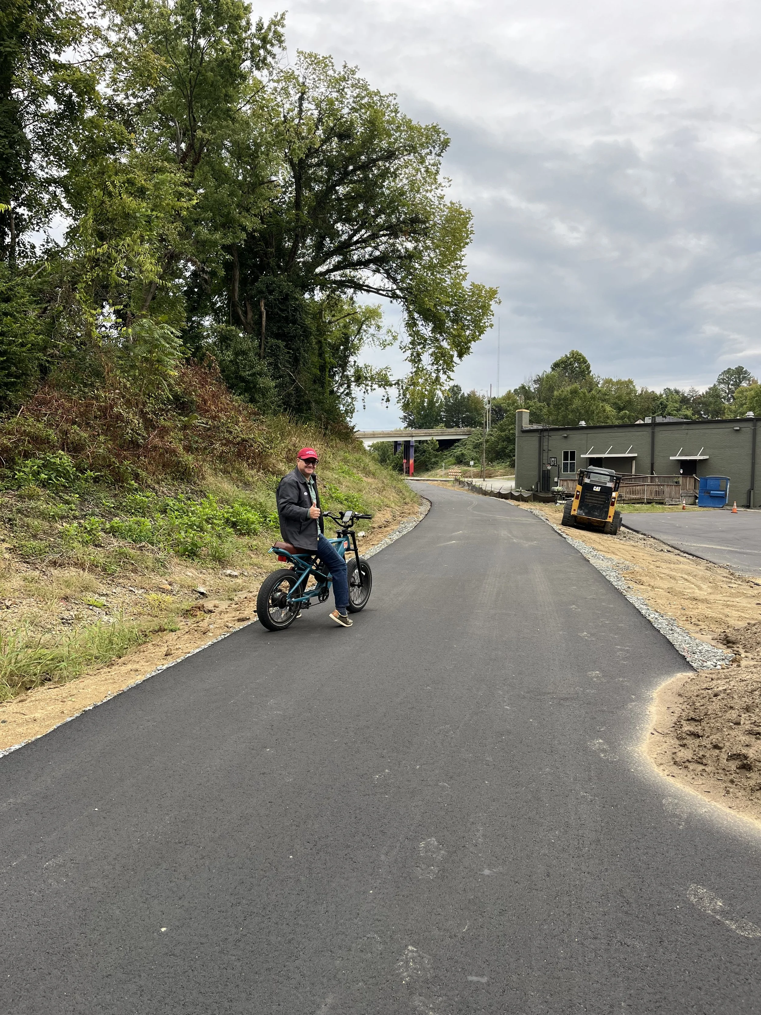  The last section of the Greenway behind Wafco Mills, between McGee Street and Spring Garden Street,  has now been paved with asphalt!! 