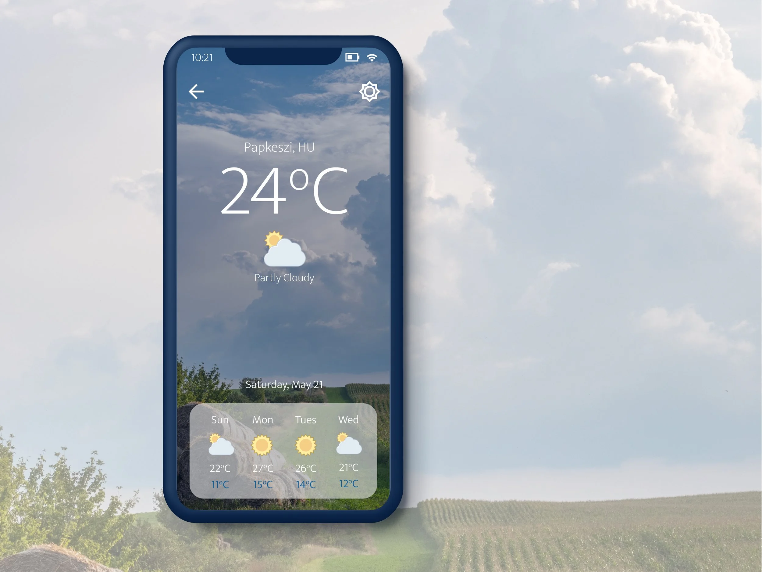 Smartphone displaying weather forecast for Papkeszi, Hungary, showing 24°C and partly cloudy conditions, with weekly forecast icons and temperatures.
