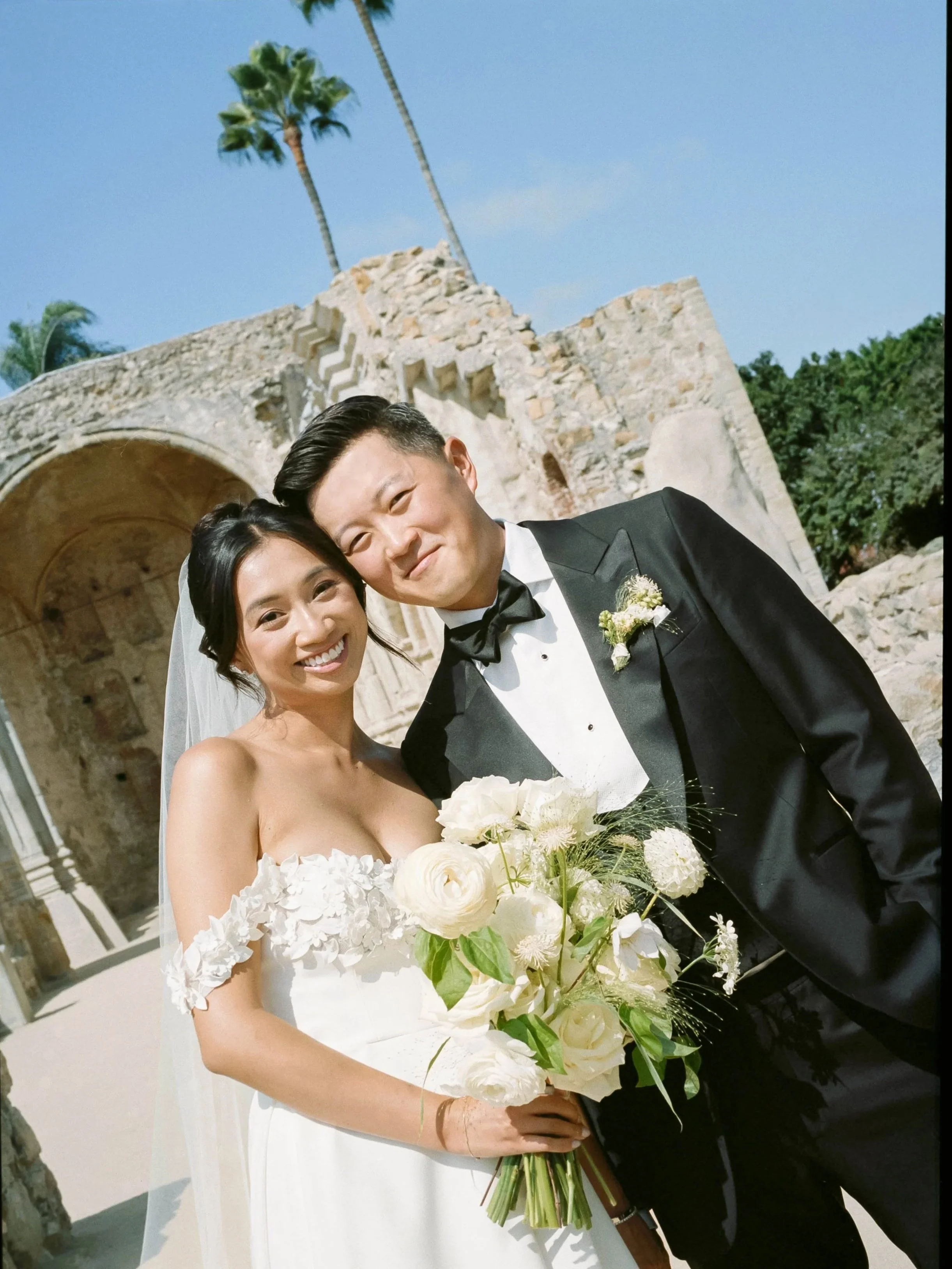 bride and groom at mission San Juan Capistrano 