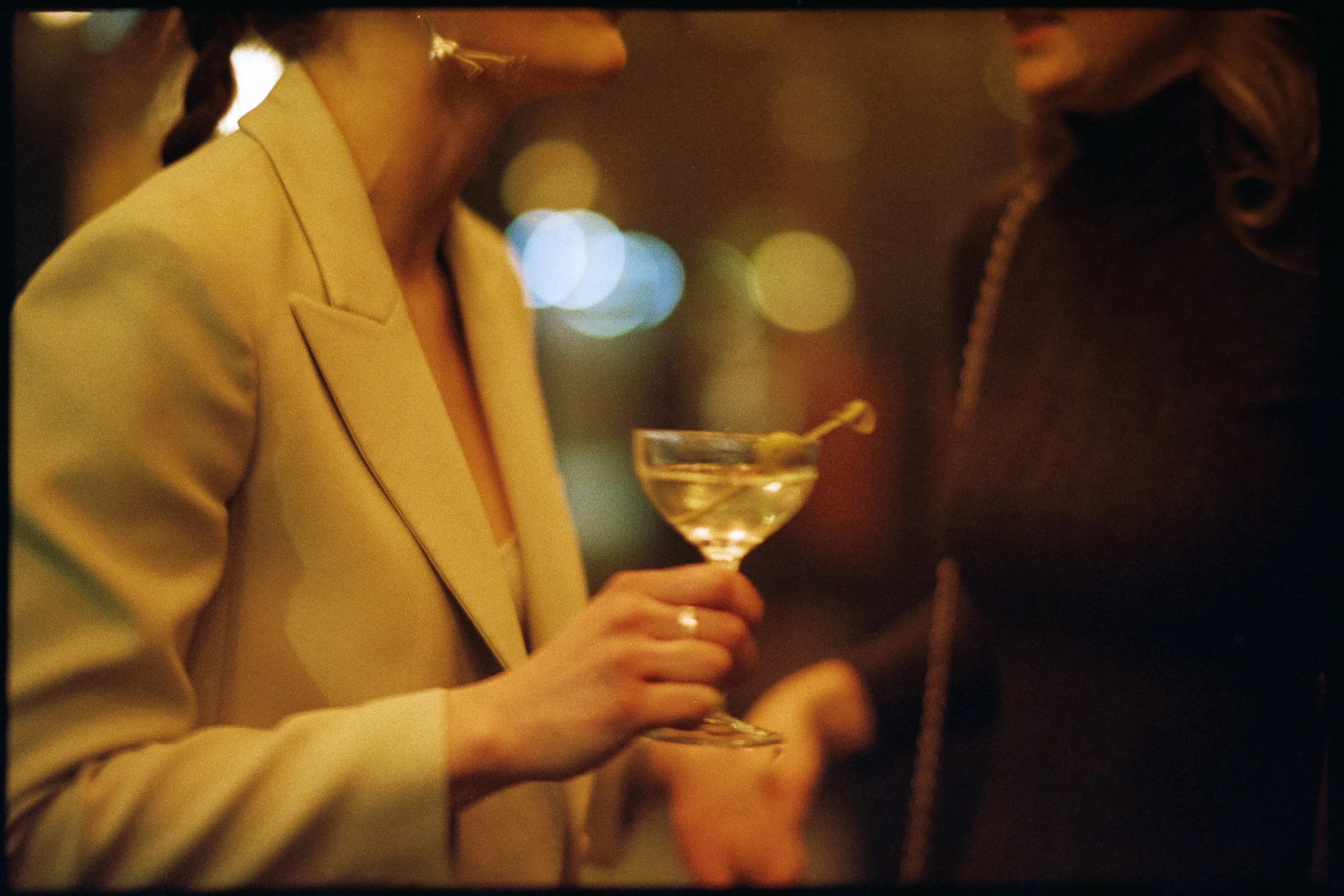 bride at ace hotel welcome party with martini Brooklyn NYC