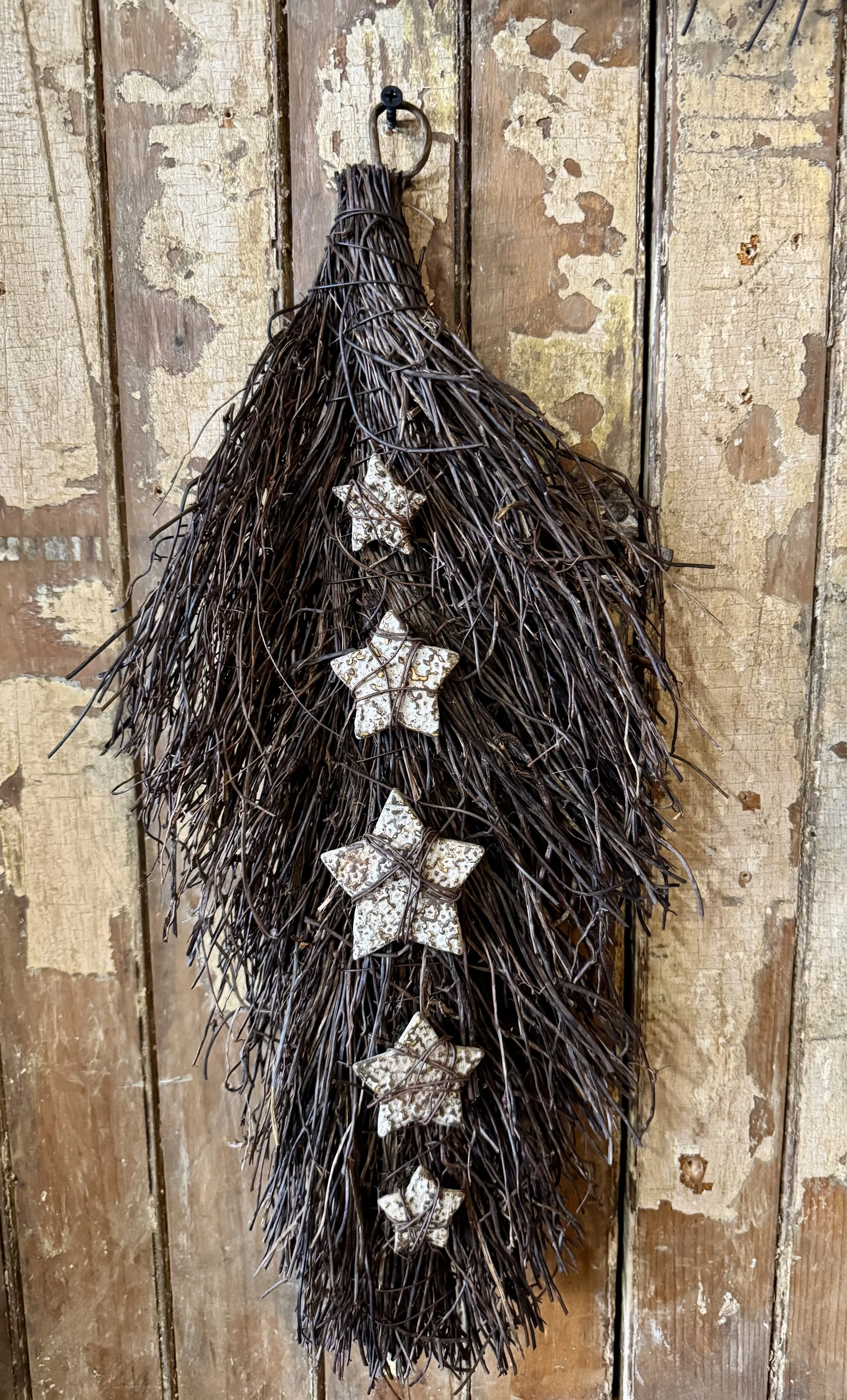 Twiggy Welcome Swag with Layered Pennies, Stars, and Starburst and Textured Stars  wrapped in Rusty Wire