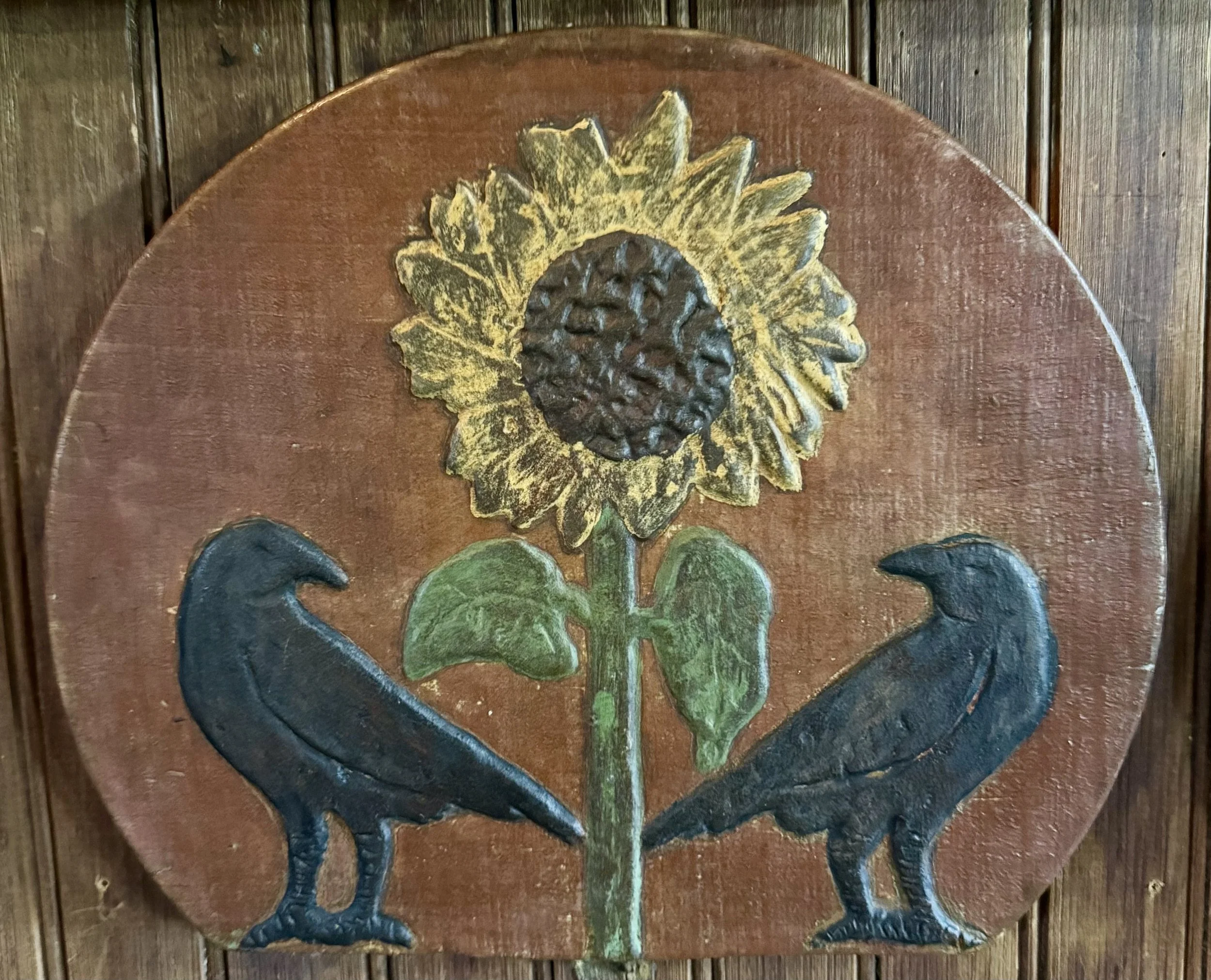 Crows Looking Back with Sunflower Between made on an Old Wooden Red Paint Sap Bucket Lid