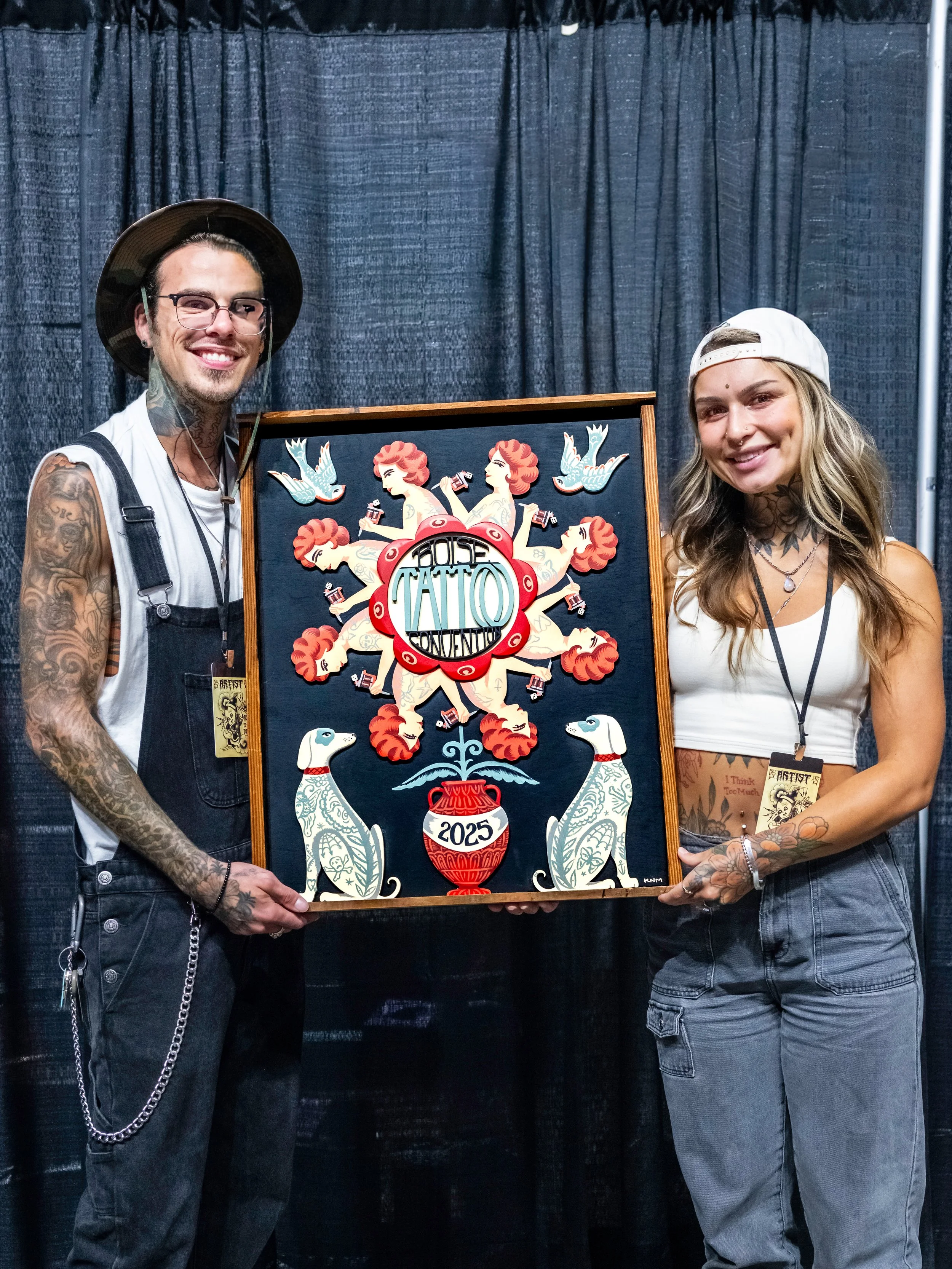 Winners or the original artwork of 2025's convention poster made by artist Kyler Martz. Tyler and Karly Andrews. The original artwork was raffled off and all proceeds went to the West Valley Humane Society. Photo by Nick Hedden @gemstatephoto