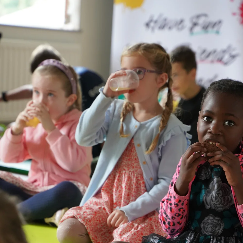 Children enjoying snacks together at Grow Kids