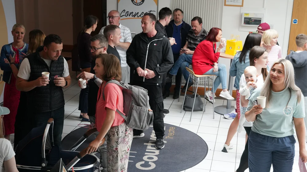 People connecting over coffee in the lobby after a service