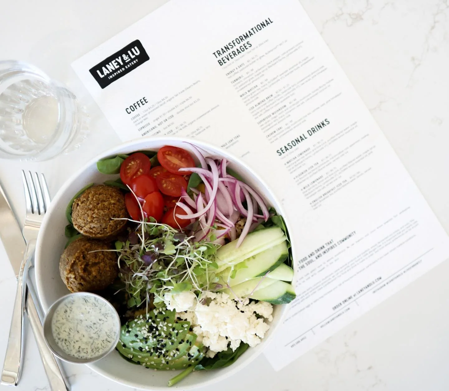 Meet your new lunch obsession: our Falafel Mediterranean Bowl 🥙

Sesame falafel piled over spinach with cherry tomatoes, red onion, cucumber, local feta, microgreens, sesame seeds + creamy avocado &mdash; finished with yogurt tzatziki and our turmer