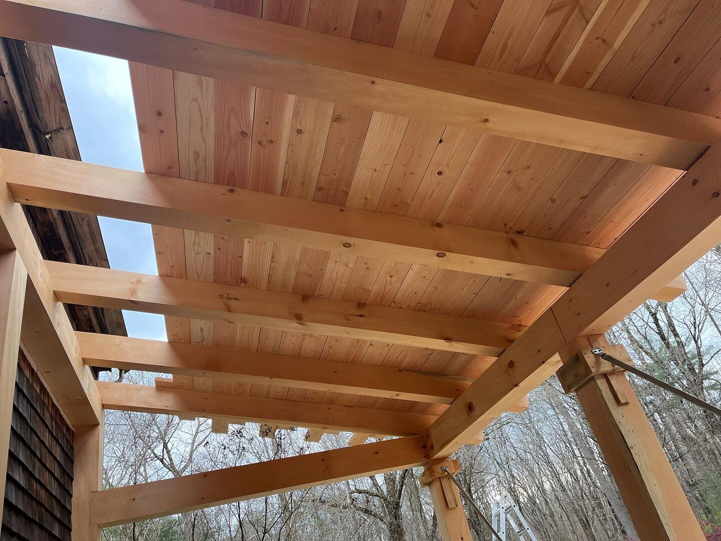 In many ways, this project is a lot like the post and beam home we framed last year, and so we&rsquo;ve had the chance here, with this addition, to apply what we learned. Today, we were able to install more 2X8 tongue and groove roof sheathing with a
