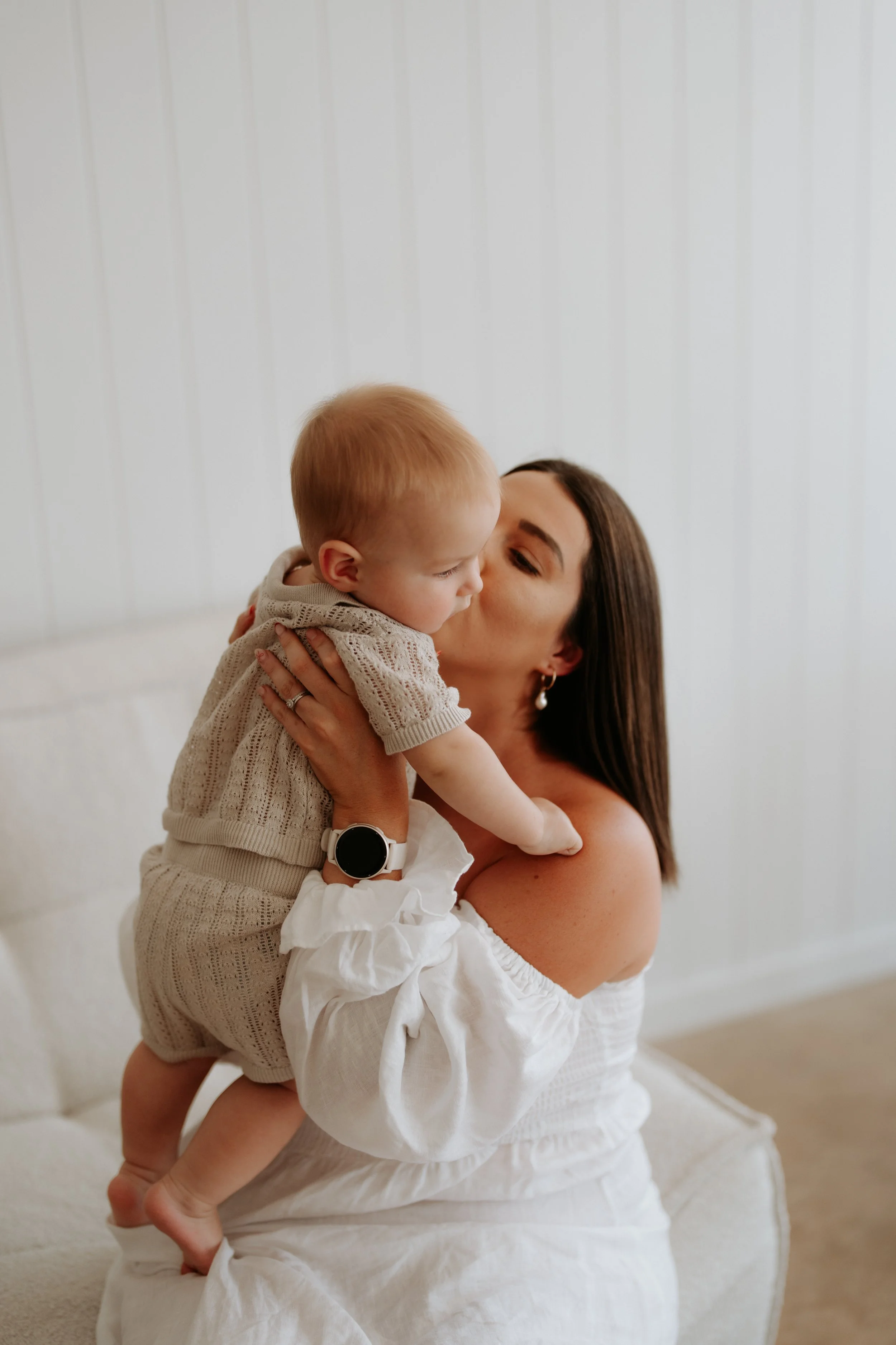 Mother cuddling her baby