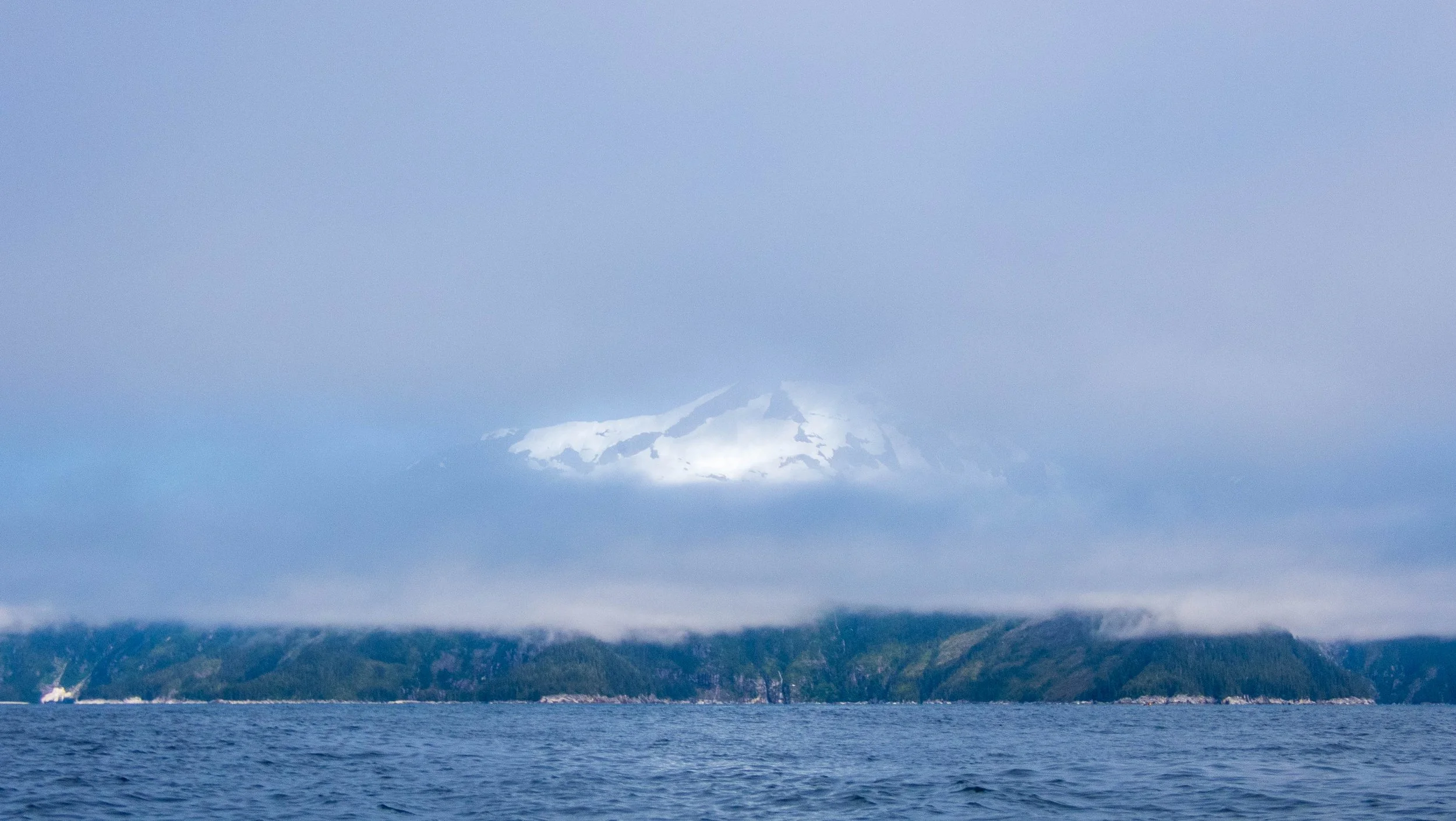 Crossing Harris Bay, with mountains peeking through the mist