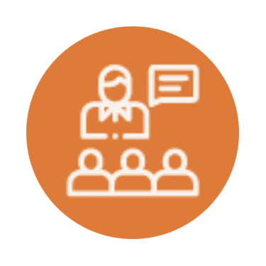 Icon of a teacher standing in front of three students with a speech bubble, all inside an orange circle.