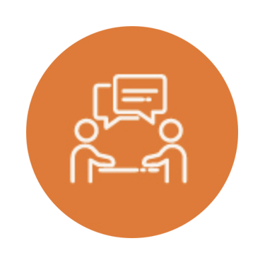 Icon of two people sitting at a table with conversation bubbles above them, on an orange circular background.