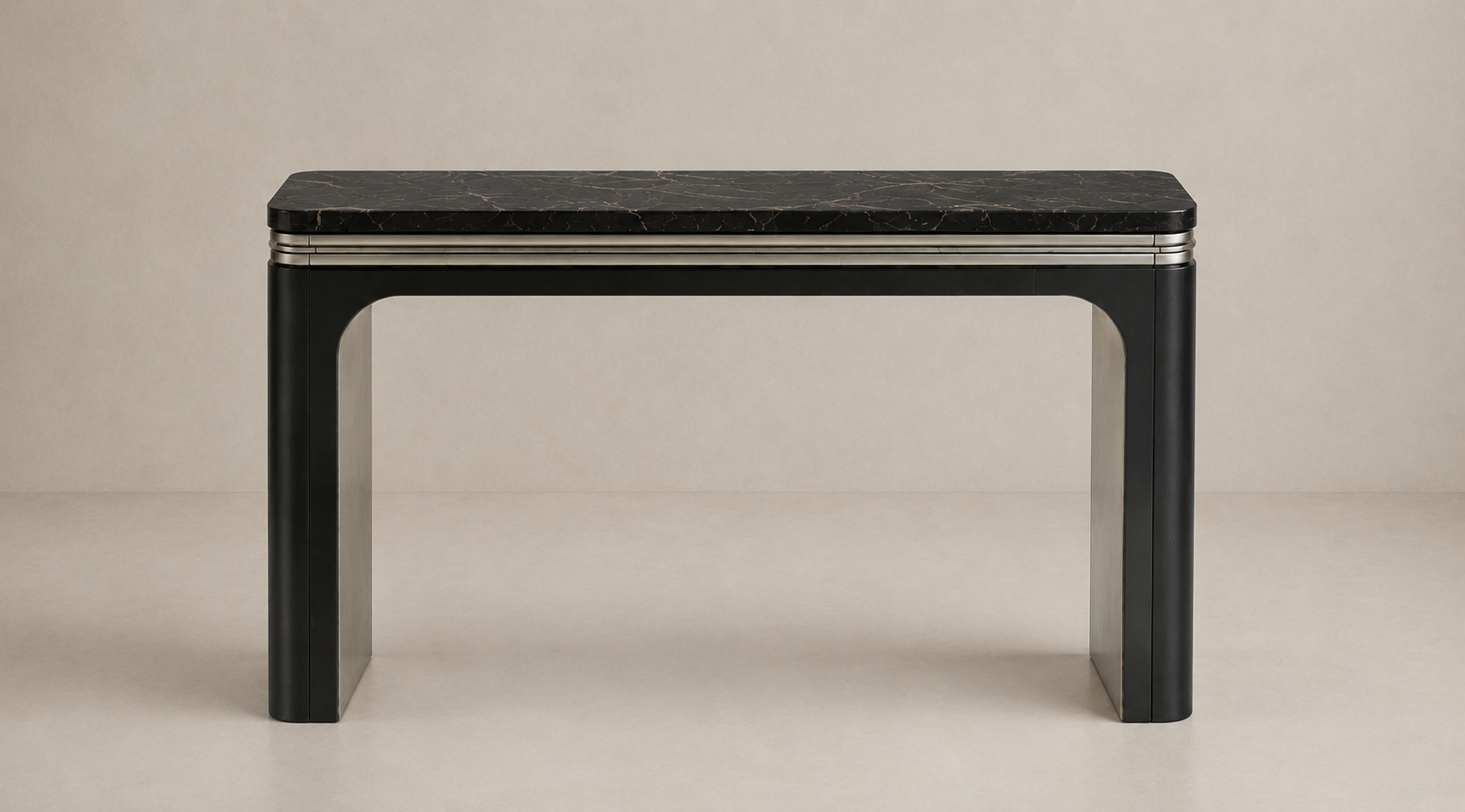 A modern black console table with a dark stone top and metallic accents, set against a plain beige background.
