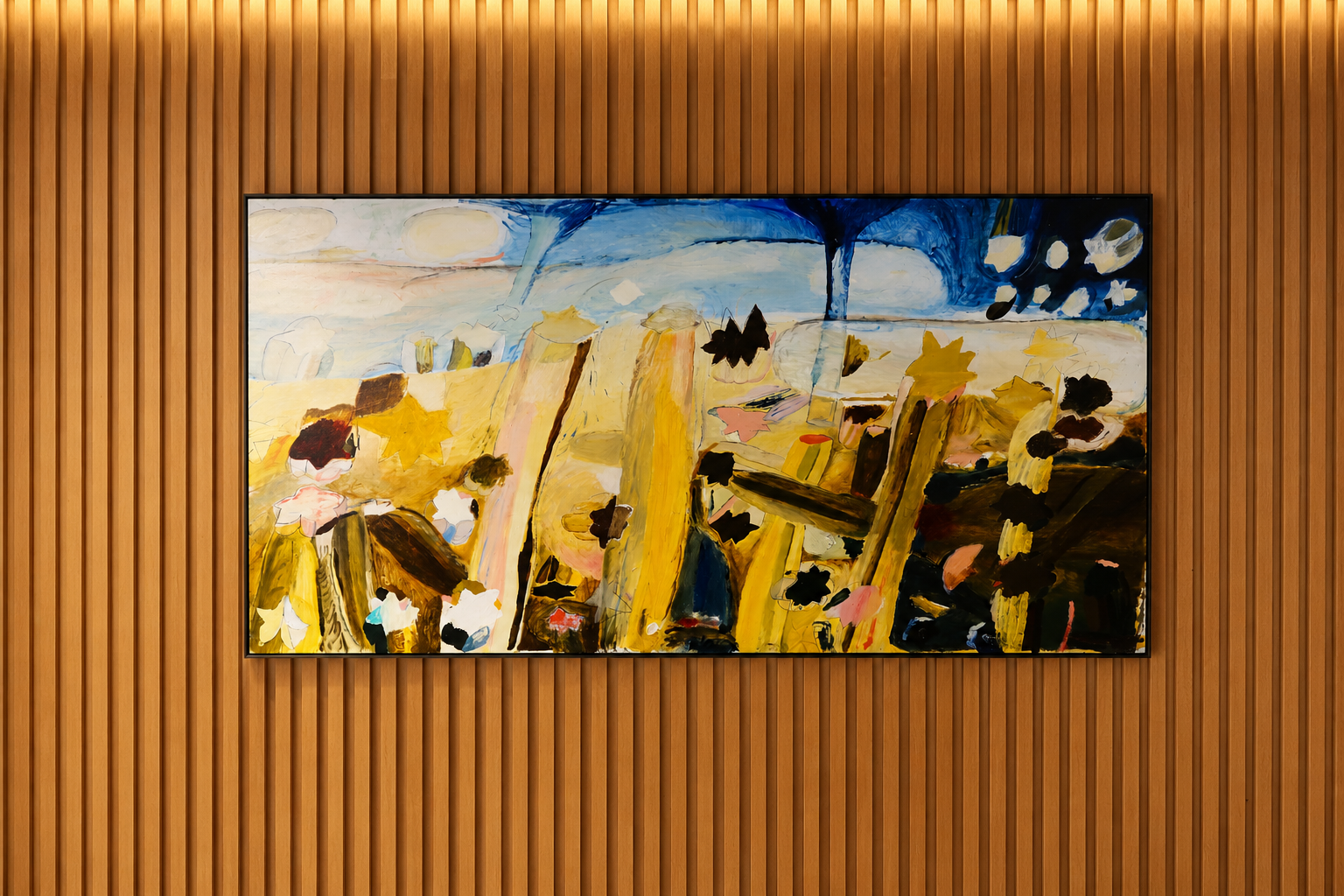 Abstract painting with yellow and brown tones, black, pink, and blue accents, mounted on a wooden slat wall.