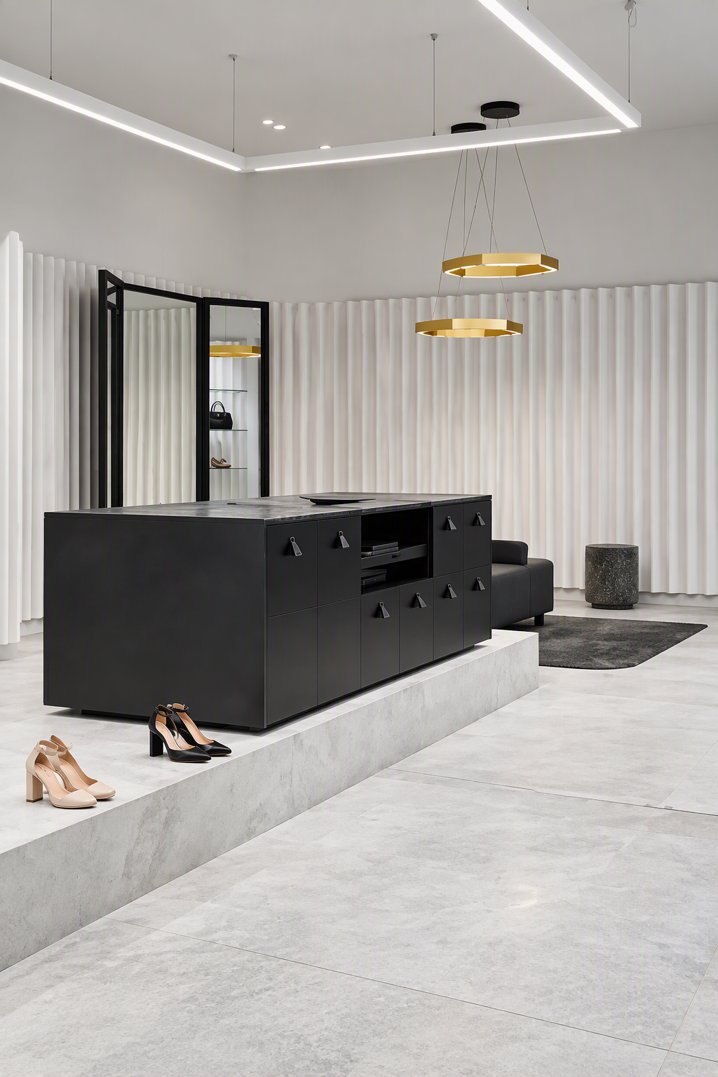 Modern interior with black cabinet, beige and black shoes on the floor, white textured walls, and gold ring chandeliers