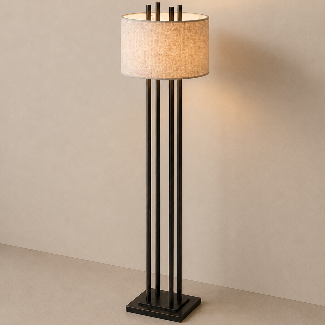 Modern black floor lamp with a beige lampshade against a plain wall.