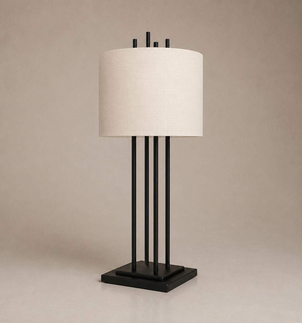 A modern table lamp with a black base, four vertical black rods, a white lampshade, and four small black finials on top, set against a neutral beige background.