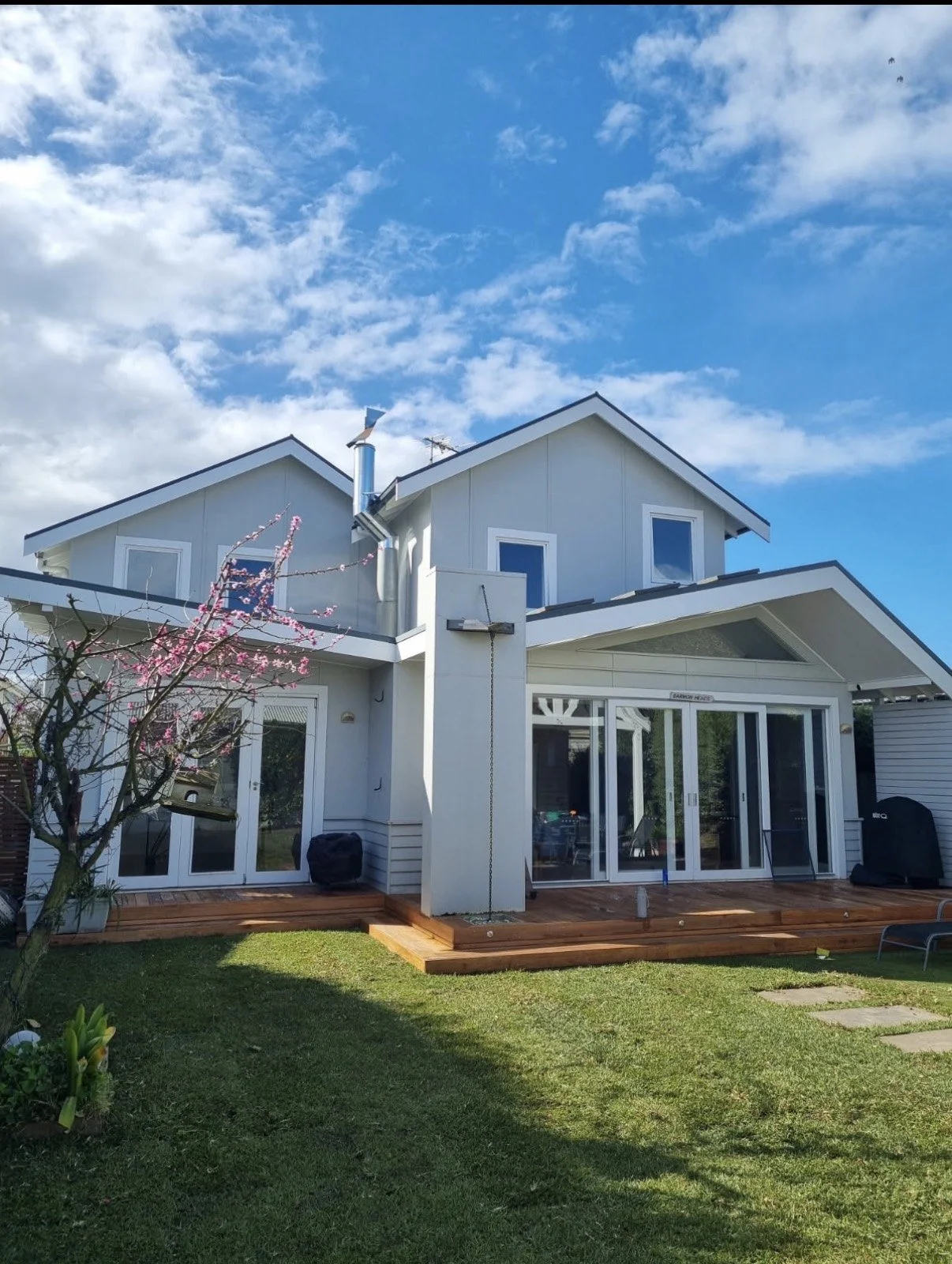 Two-storey home extension in Geelong by Oriondo Projects, rear view with timber deck