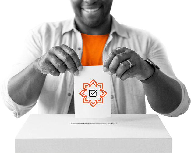 A voter holding a ballot paper marked with the Muslim Votes Matter emblem