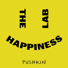 Yellow background with black text that reads 'The Lab of Happiness' arranged in a circular pattern, and 'Pushkin' at the bottom.