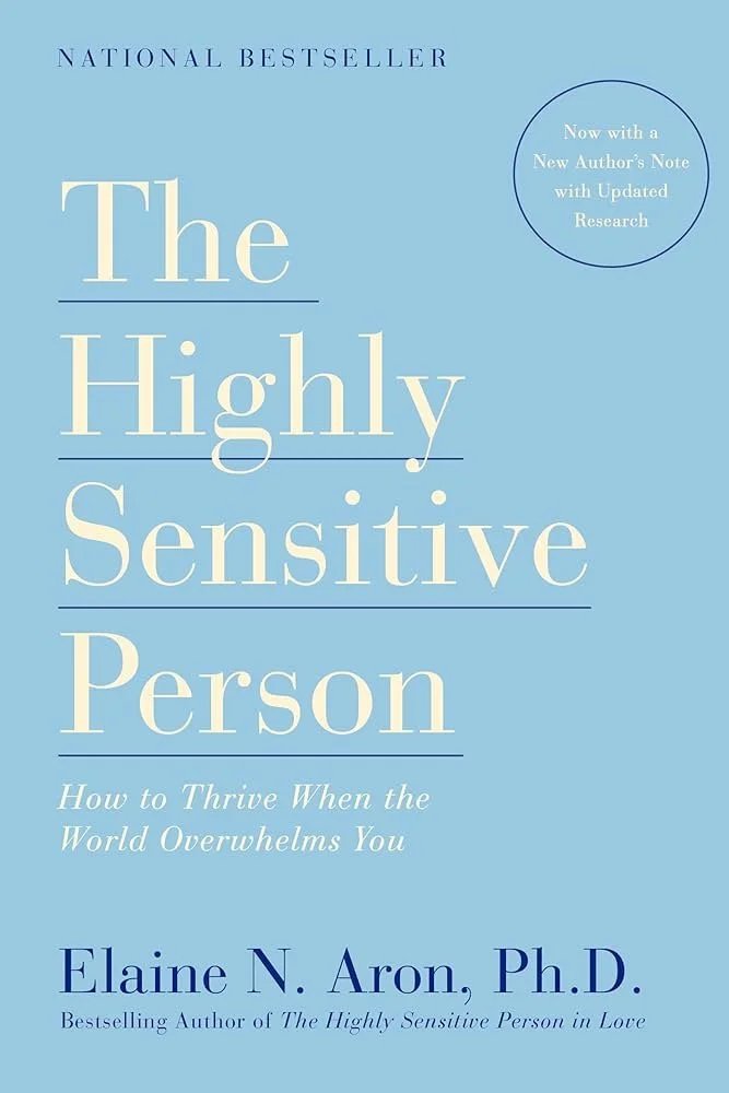 Book cover titled "The Highly Sensitive Person" by Elaine N. Aron, Ph.D. with a subtitle "How to Thrive When the World Overwhelms You". The cover mentions it's a National Bestseller and has an updated research note.
