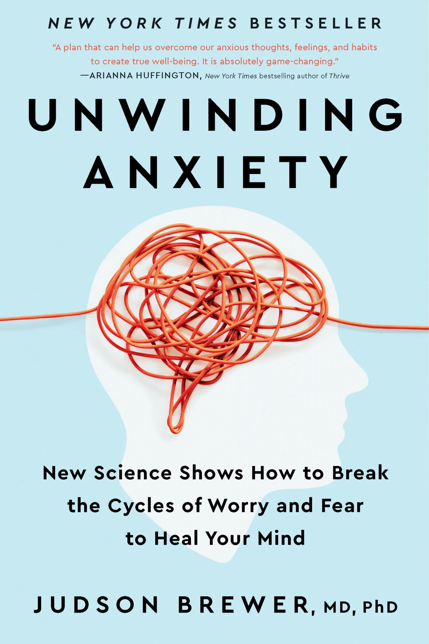 Book cover for "Unwinding Anxiety" by Judson Brewer, featuring a white silhouette of a human head with a tangled red wire inside representing a brain, and text about overcoming worry and fear to heal the mind.