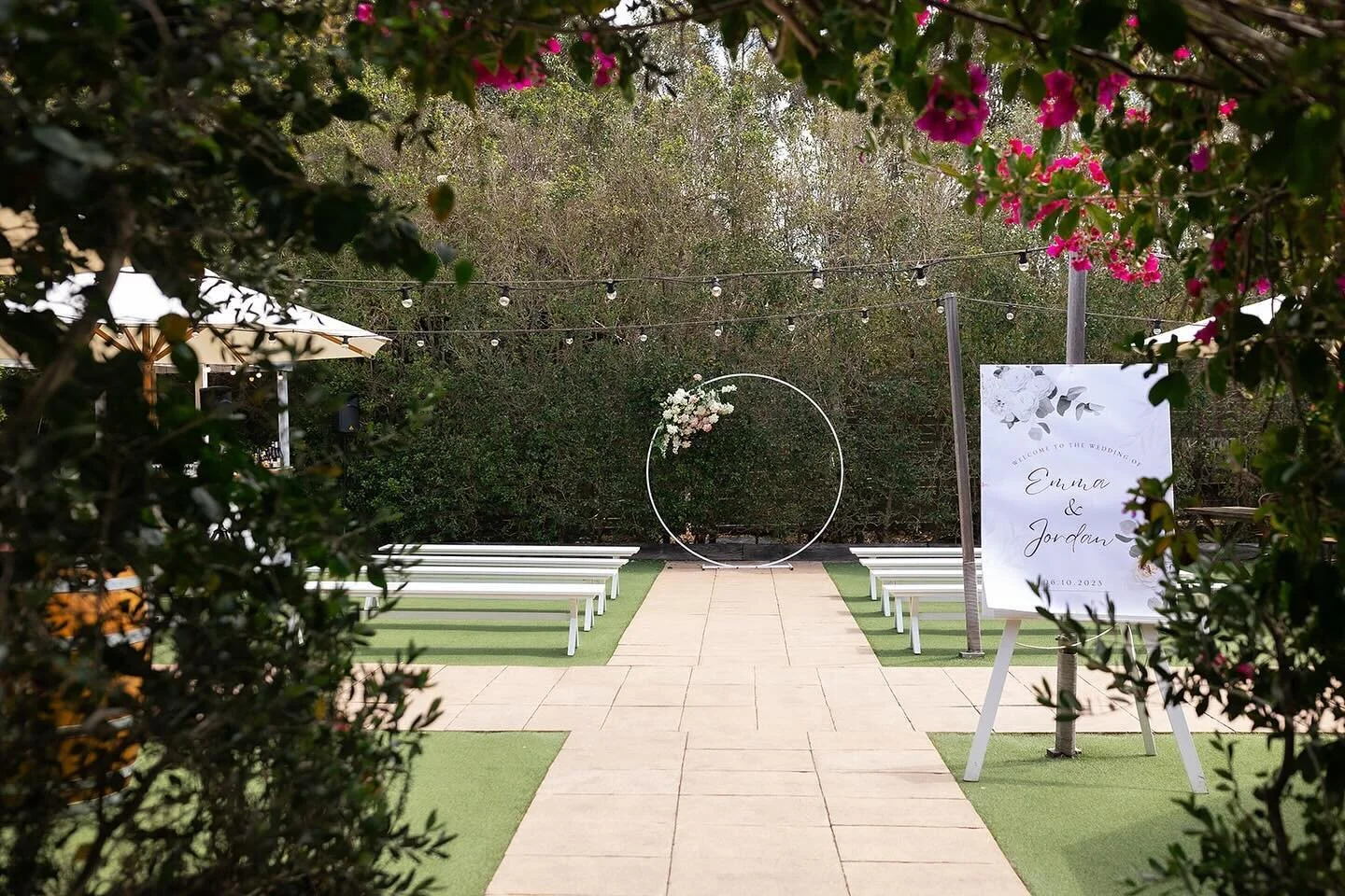 Circle of love and flower arches. Not a bad aisle to walk down.