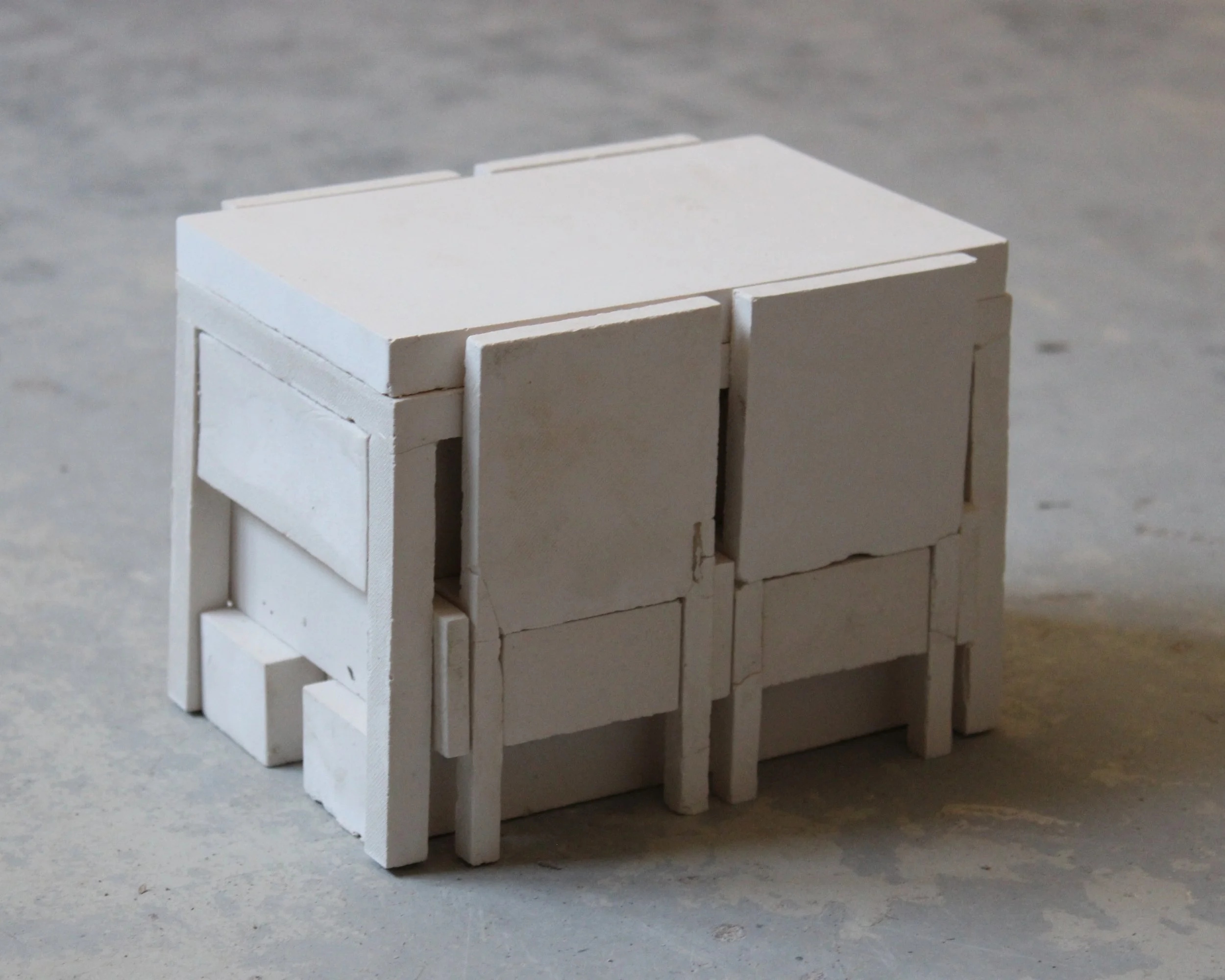 Interlock, 2025 - 38 plaster pieces, study model 1:10 (9 × 9 × 12 cm) 