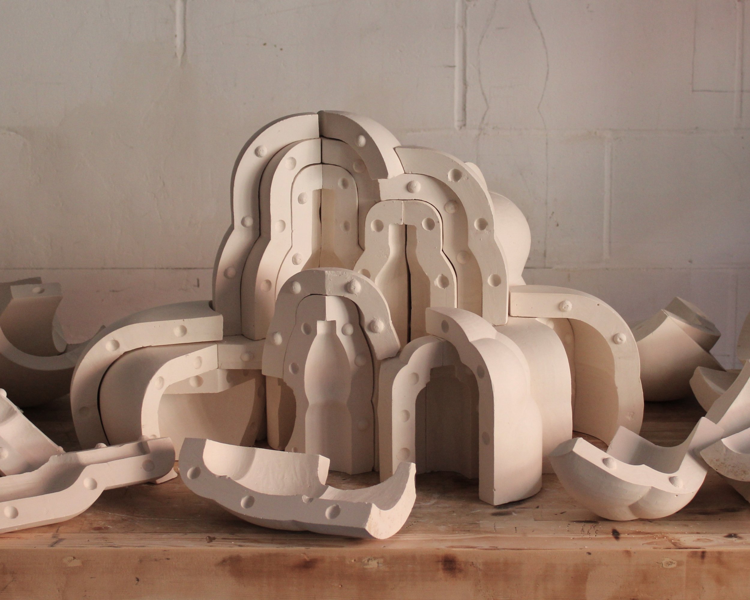 Grembo plastico (plastic womb), 2026, 81 plaster pieces, 66 x 54 x 41 cm.