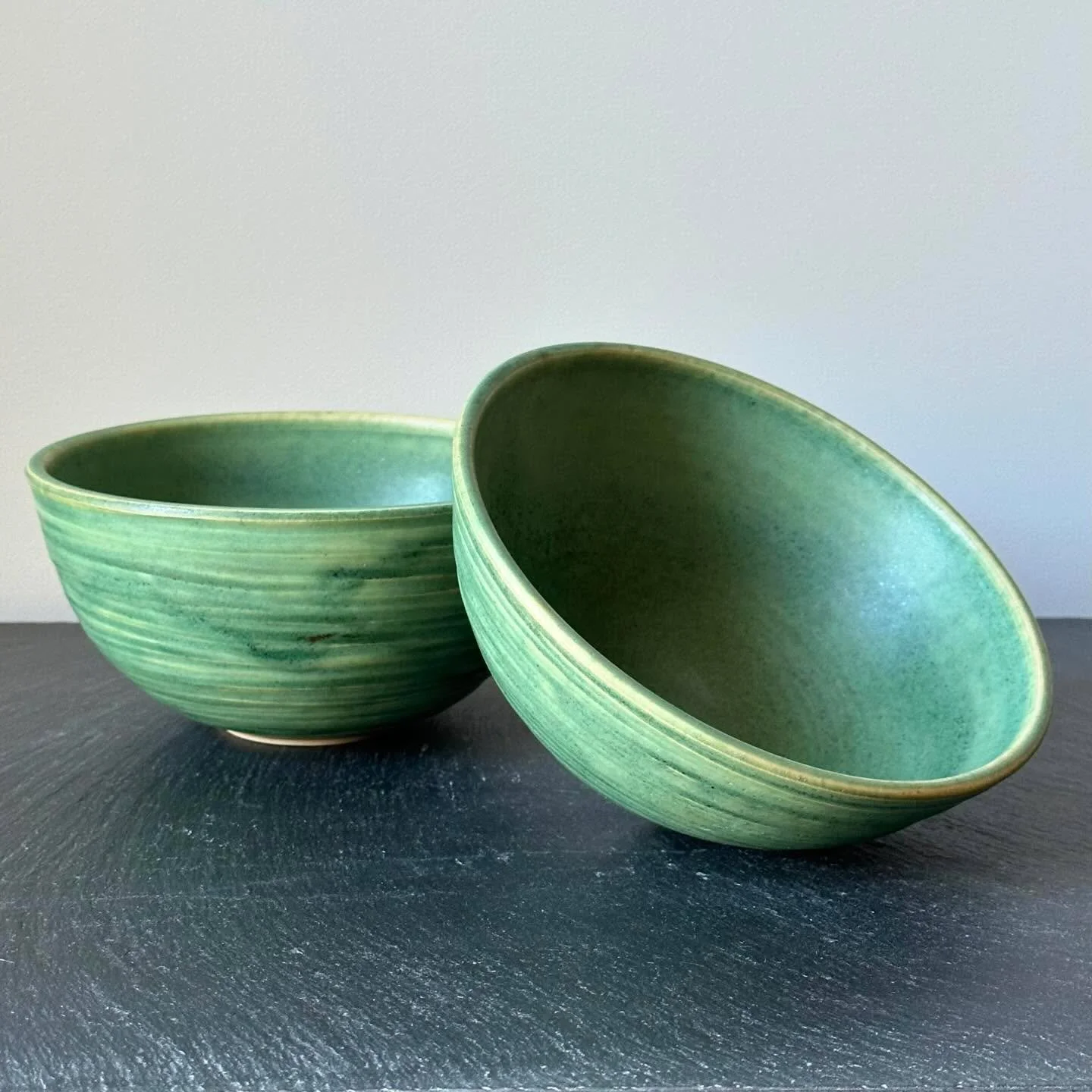 I&rsquo;m in love with the way this green glaze morphs on pieces carved with grooves&mdash;thin spots of the glaze turn golden shades, creating a pattern that looks like some kind of exotic tropical leaf. These 6-1/2&rdquo; bowls were reduction fired