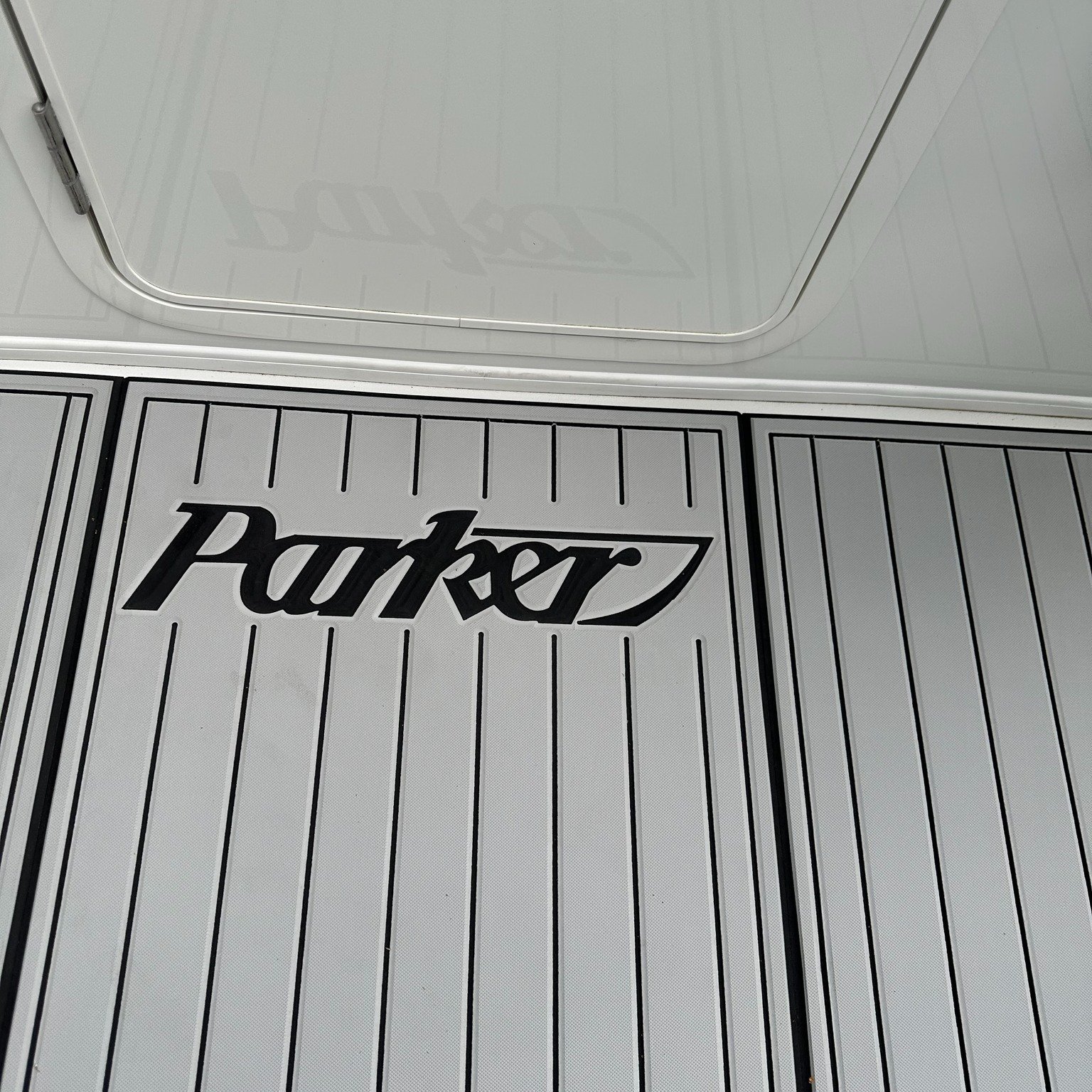 The owner of this Parker 2520xl is an avid SCUBA diver who was seeking to enhance his deck experience. Dissatisfied with the slippery surface, he desired a more comfortable solution for gearing up. We upgraded the boat with our 9mm knurled titanium f