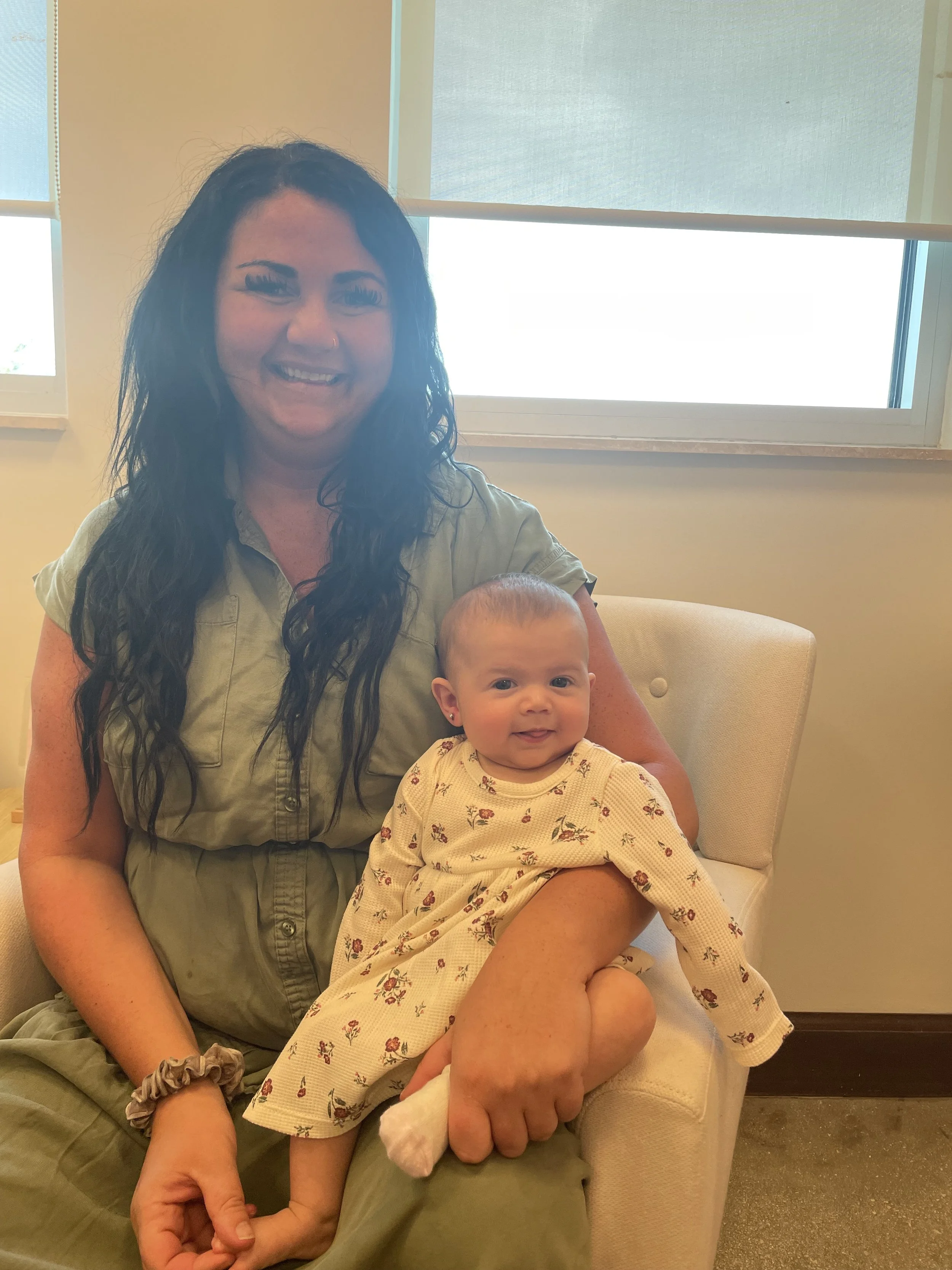 Mother and baby at Rise and Shine Pediatrics ear piercing appointment in Boca Raton FL