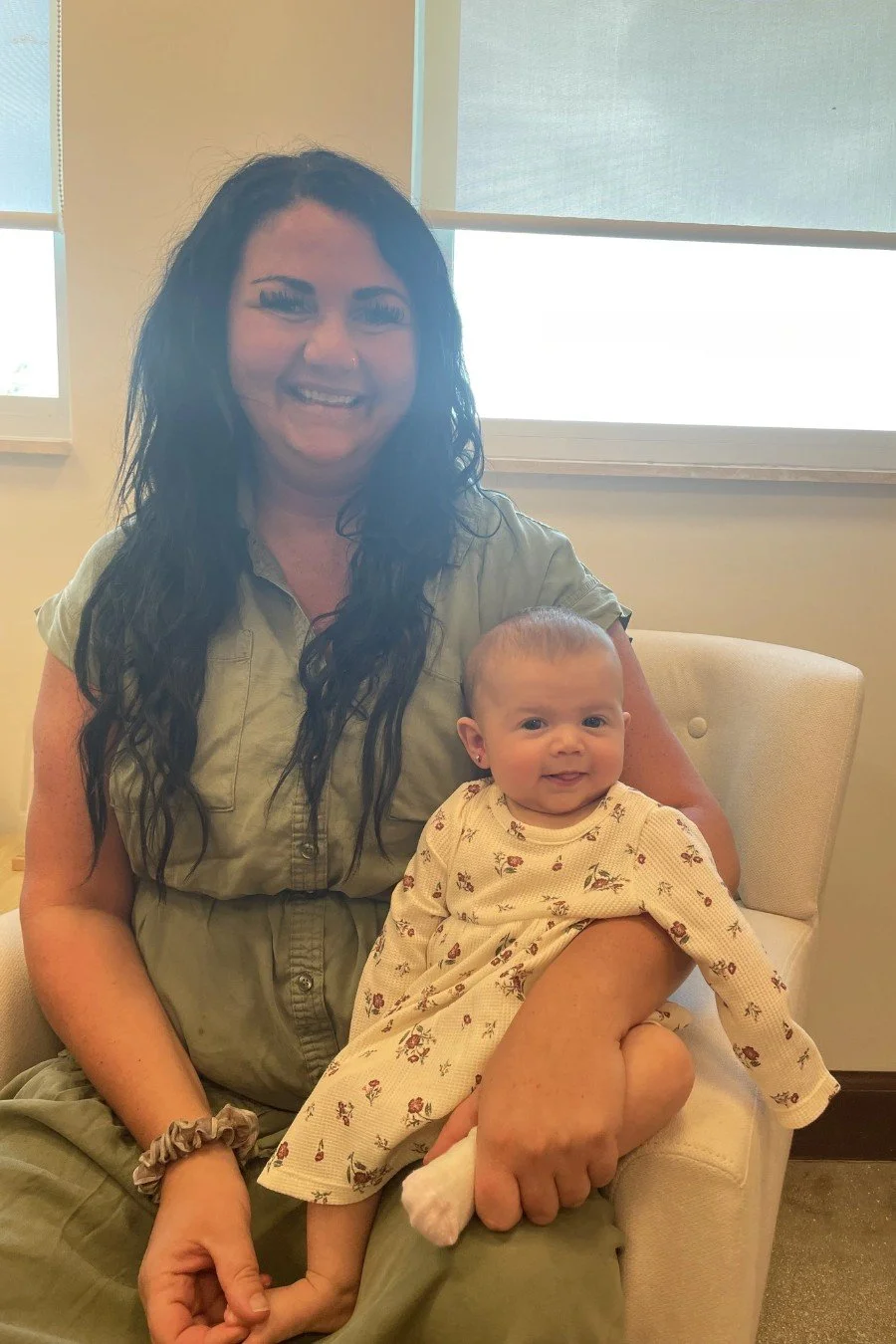 Mom holding her baby at Rise & Shine Pediatrics