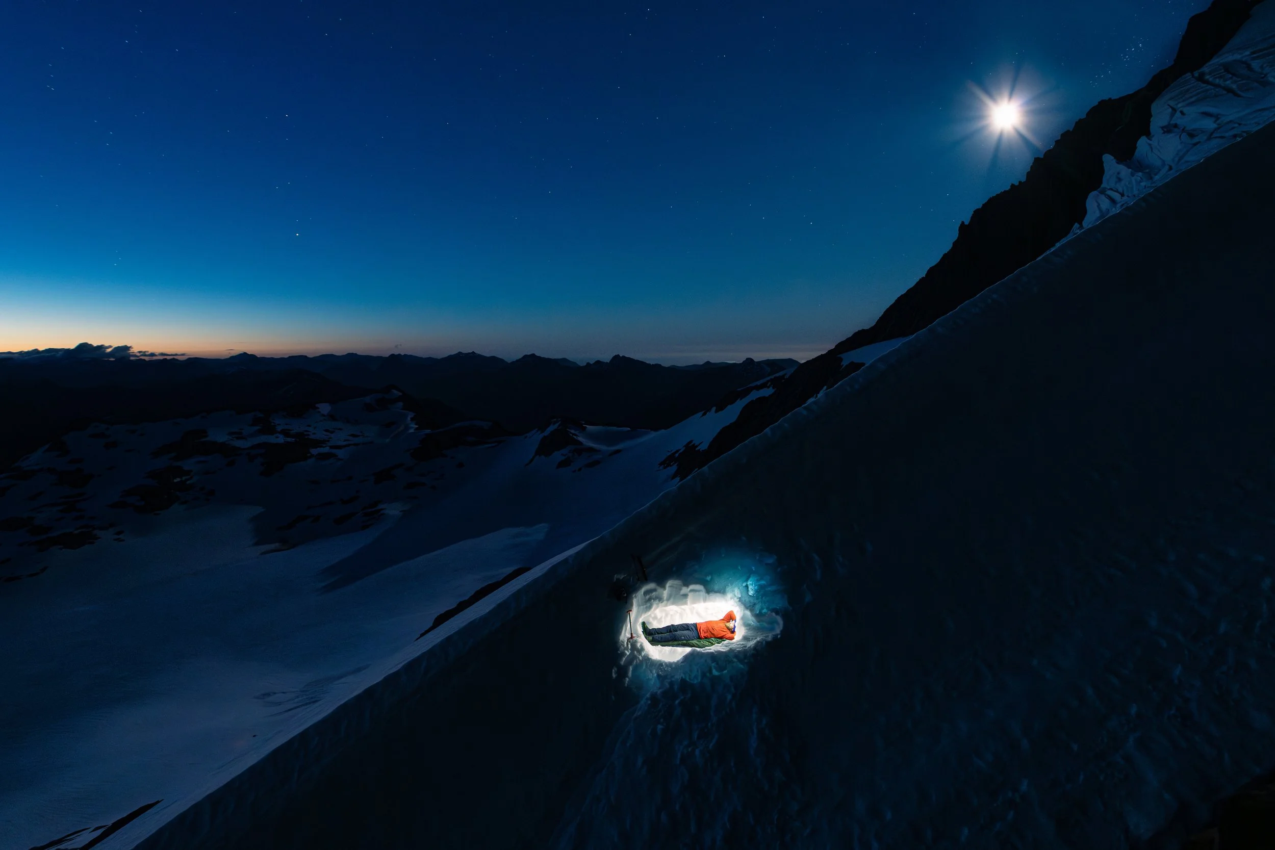 Sleeping under the moon in a snowcave on Mount Brewster Glacier 