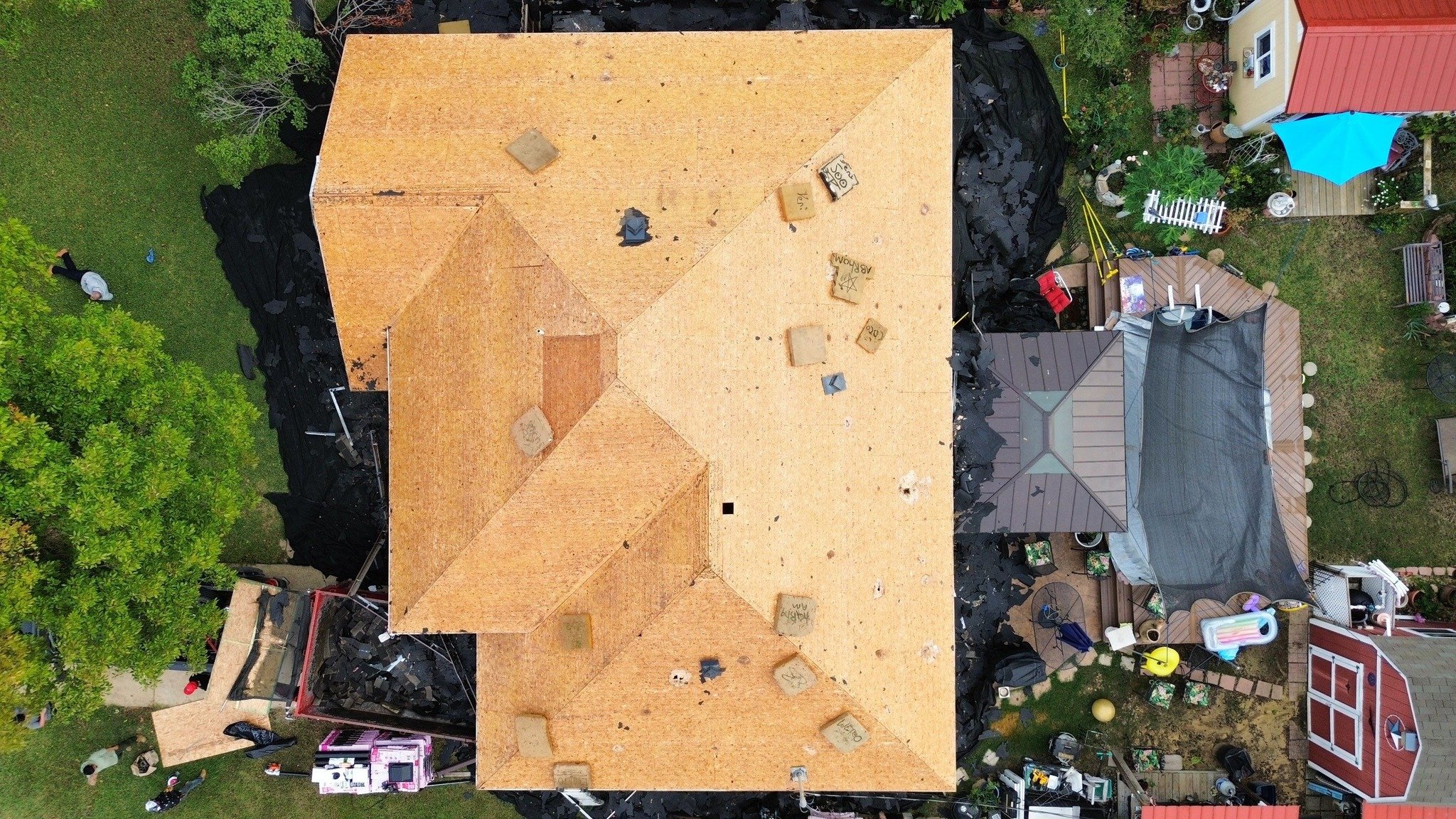We believe in showing the whole process, not just the final result.

Photo 1: The roof is stripped all the way down to the decking. This step is crucial because a solid foundation makes all the difference.
Photo 2: Our crew is installing the shingles