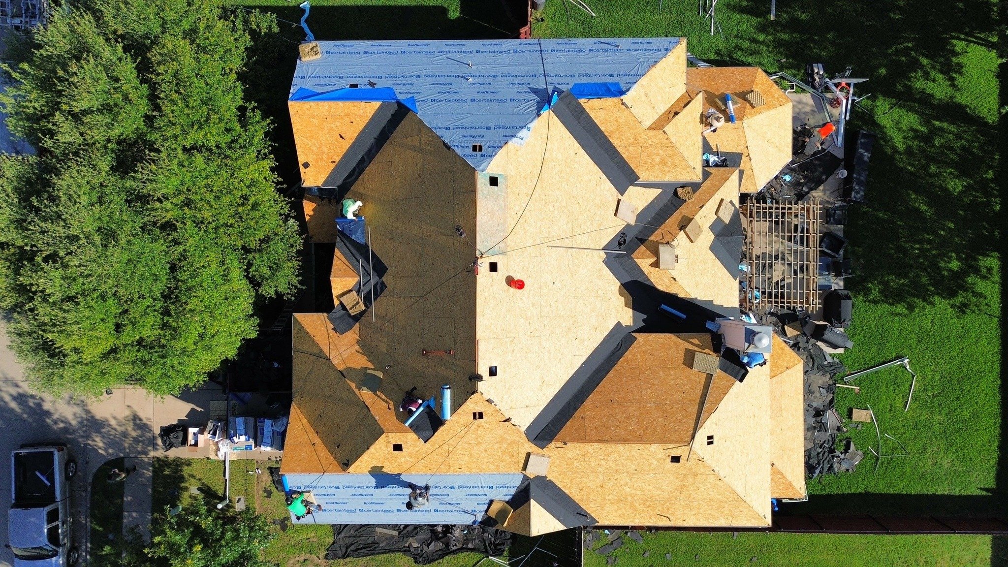 We believe in showing the whole process, not just the final result.

Photo 1: The roof is stripped all the way down to the decking. This step is crucial because a solid foundation makes all the difference.
Photo 2: Our crew is installing the shingles