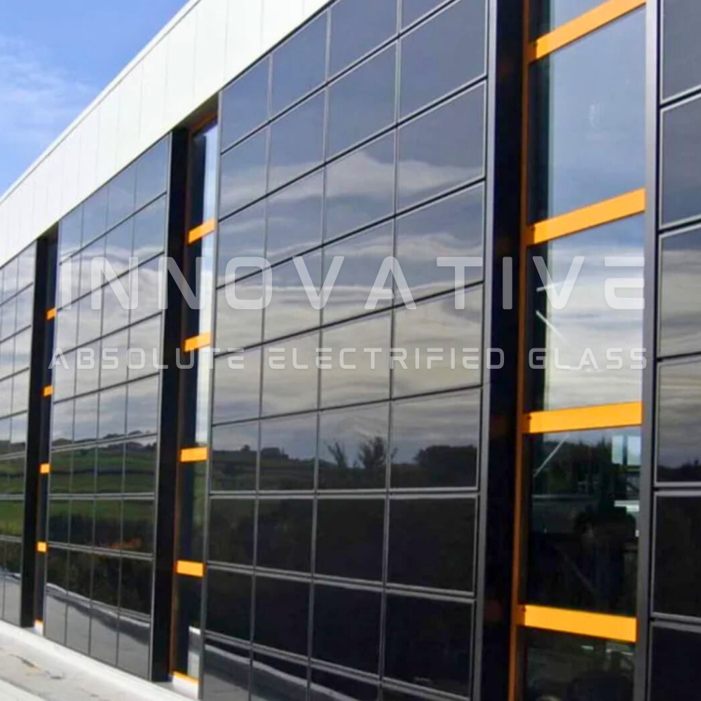 Innovative Absolute Electrified Glass featured as black windows on commercial building.