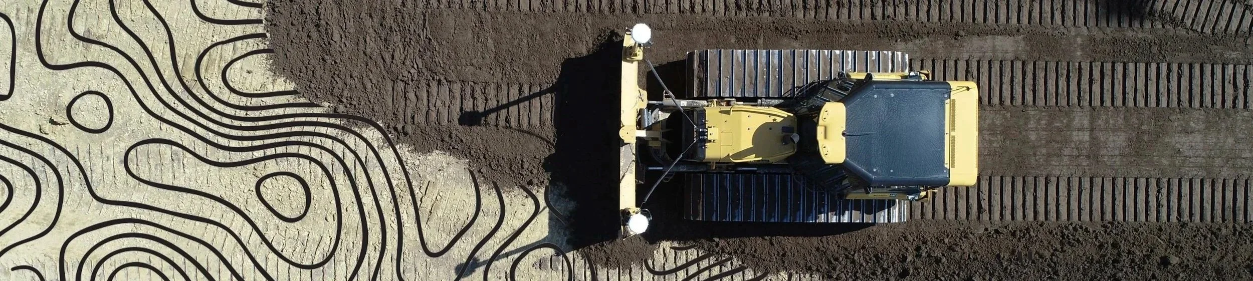 Bulldozer grading using GPS machine control models on a construction site