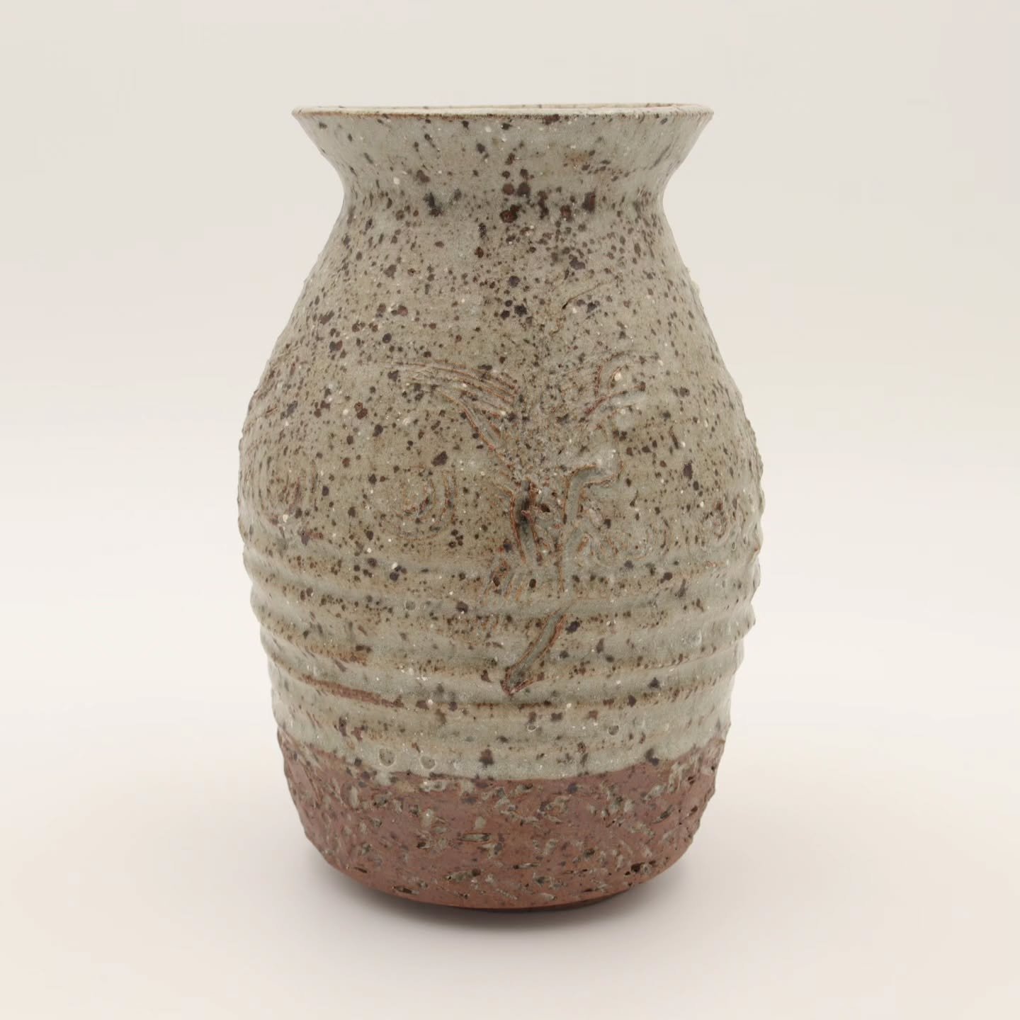 Lot 41 &ndash; Large Handmade Art Pottery Vase

A stunning statement piece for any space! This mid-century modern art pottery vase features elegant beige and brown hues, a beautifully handcrafted form, and a rich glaze that highlights its organic cha