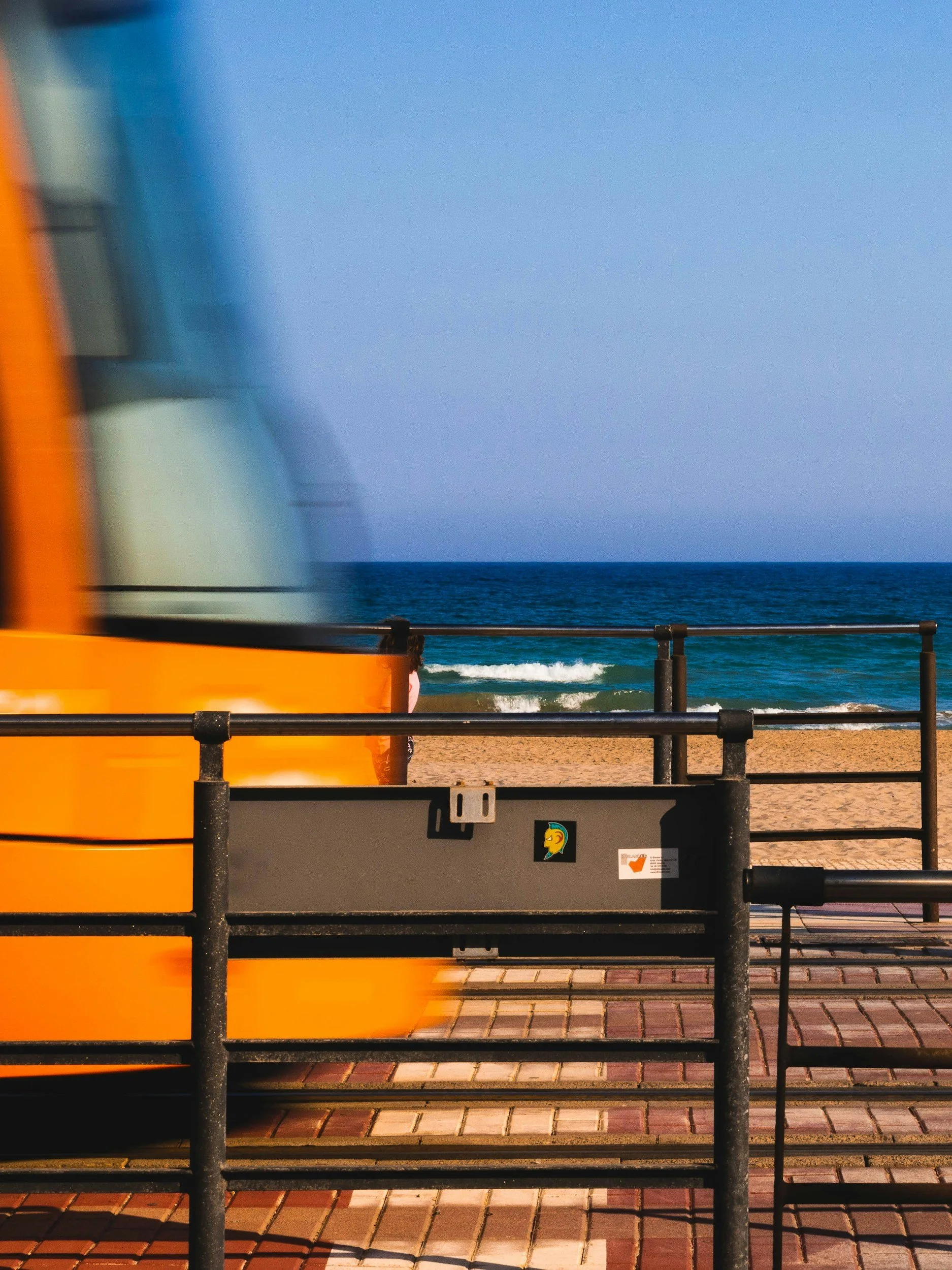 train in spain by beach