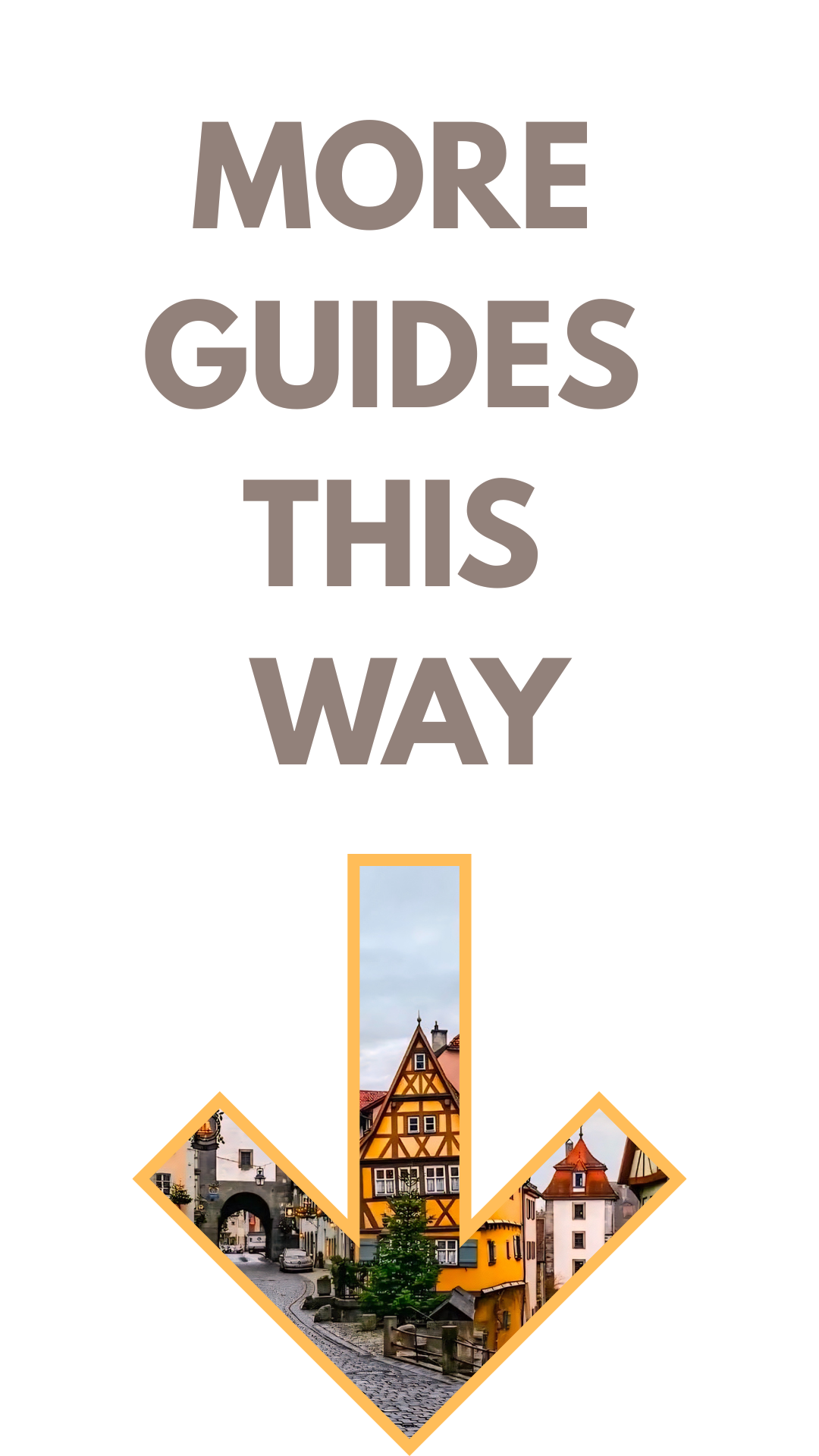 Sign with the text "More guides this way" and a photograph of a European street scene with colorful half-timbered buildings and cobblestone street.
