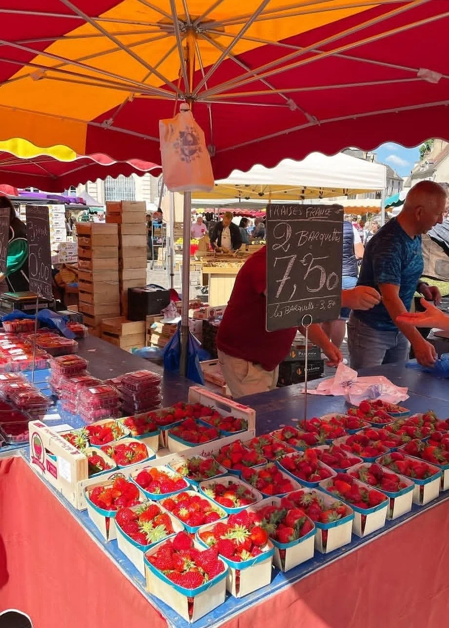 strawberries in beaune market stall