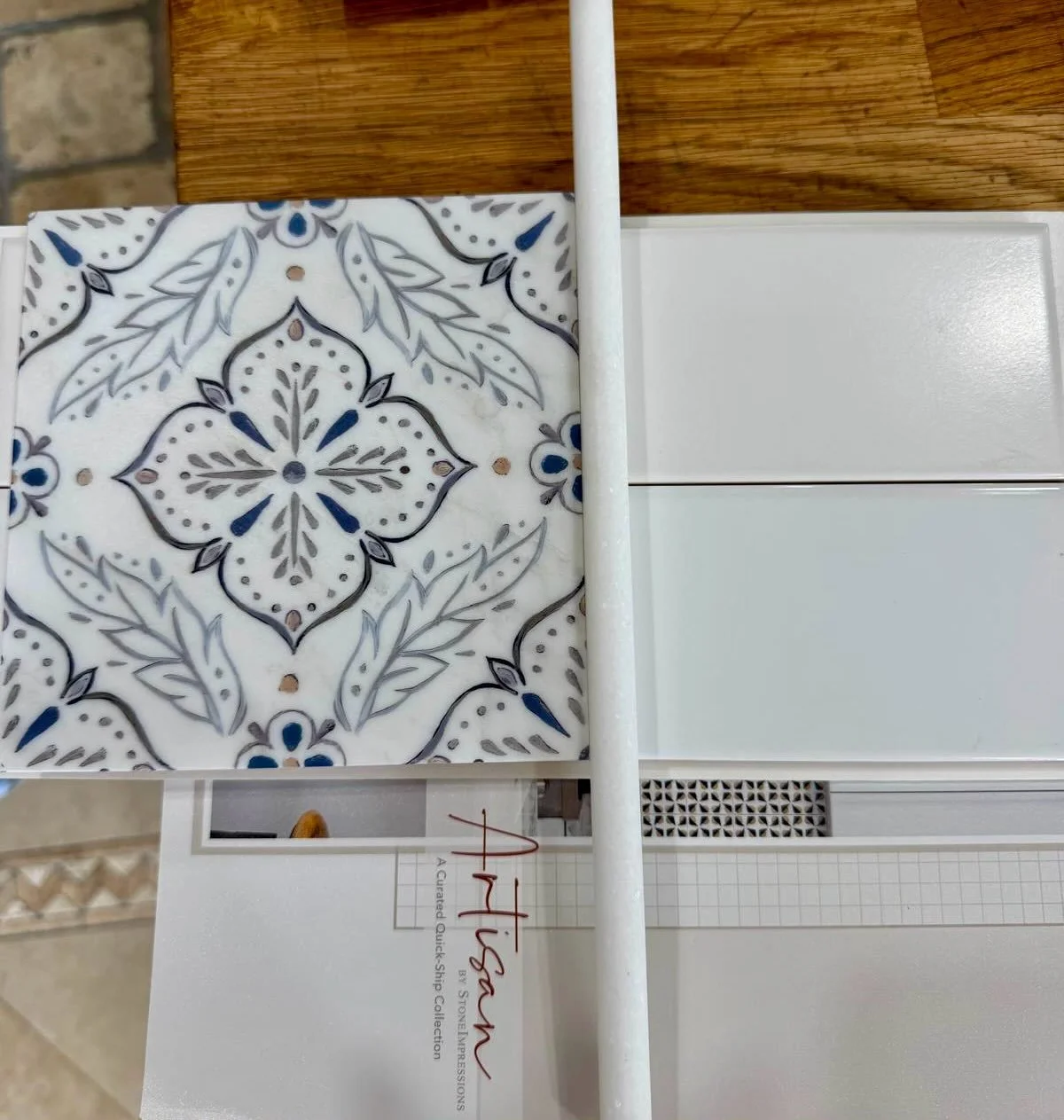 A Touch of Old-World Romance
For this kitchen, my client wanted a statement with a romantic, old-world feel.

We chose these beautiful handmade Spanish-Portuguese inspired tiles, featuring delicate floral patterns in soft blue and smoky gray tones.

