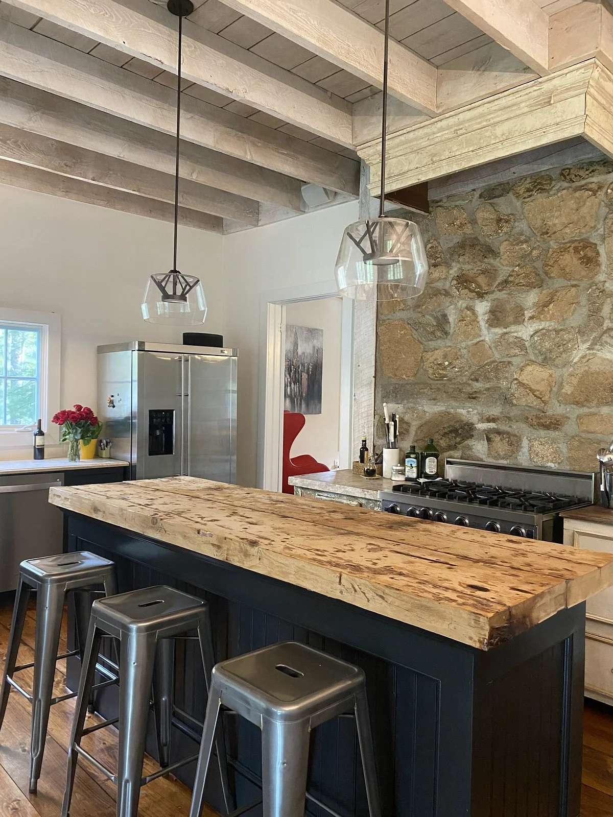 Reclaimed wood island and stone wall