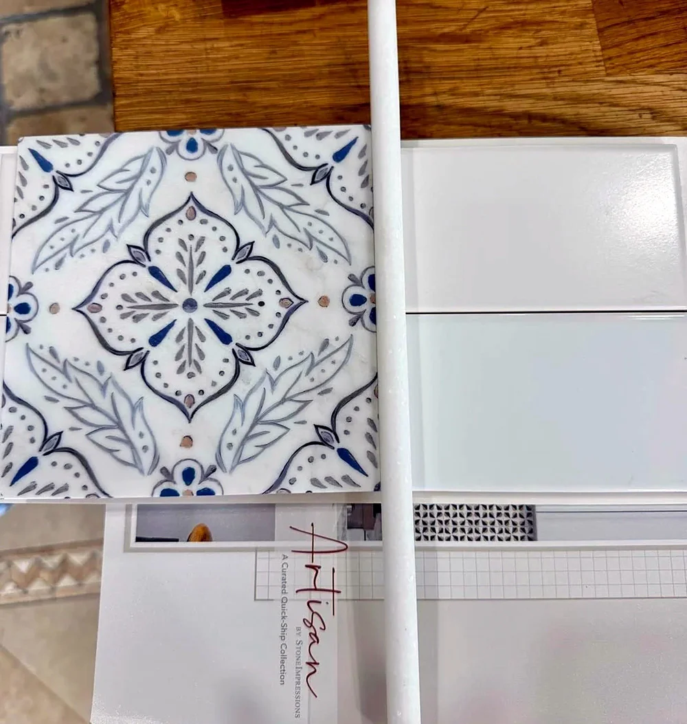 Hand-painted tile chosen for a kitchen range wall