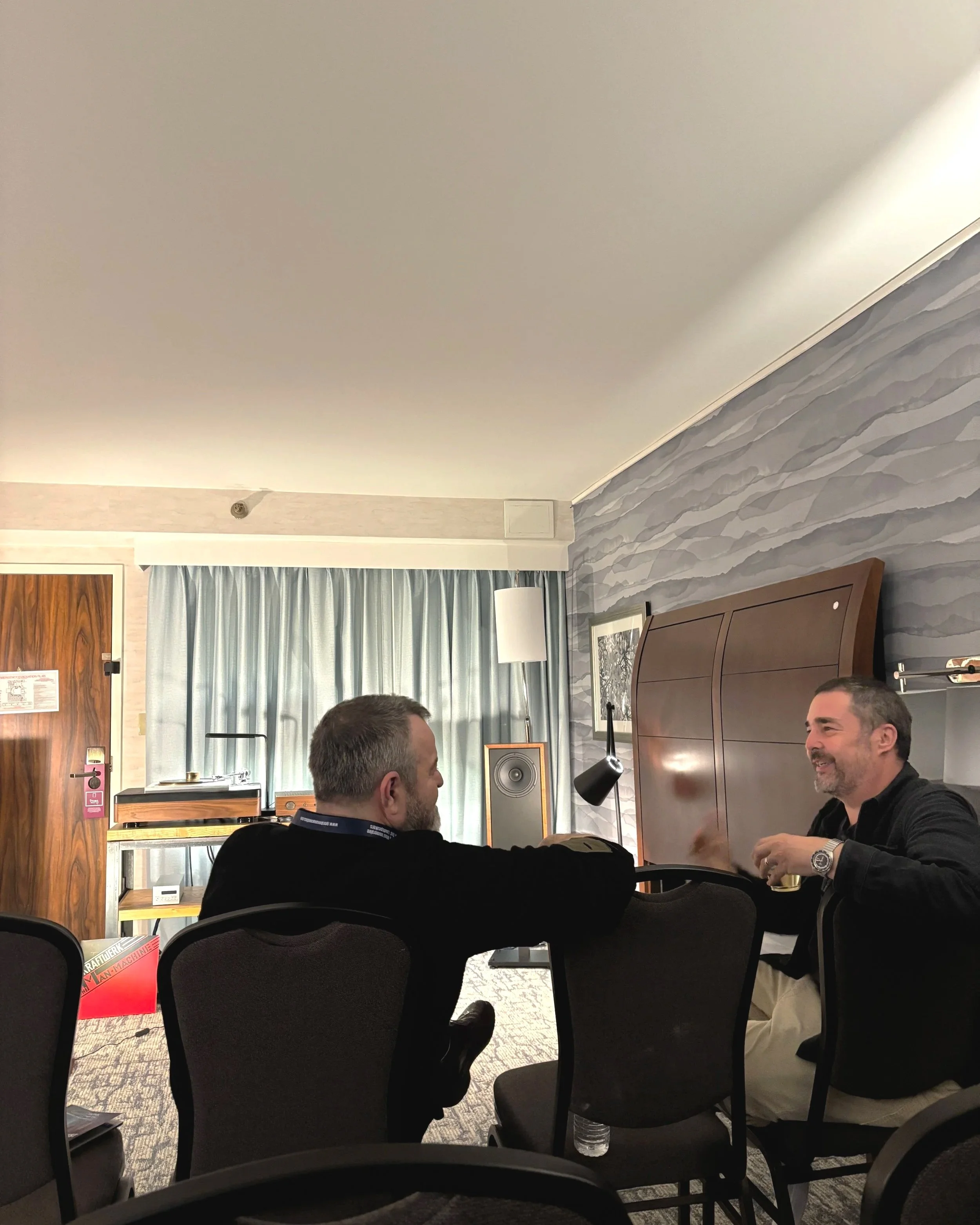 Christopher Hildebrand in the Fern & Roby listening room at Capital Audiofest 2025, with Raven II speakers, Archival Turntable, and Fern & Roby Amp No. 2