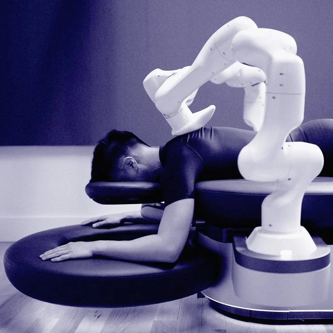 Person lying face down on a massage table.